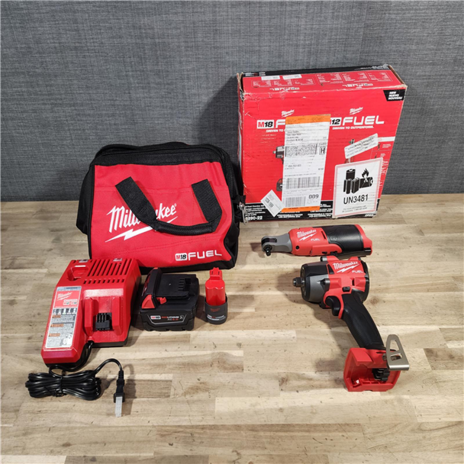 HOUSTON LOCATION - AS-IS (APPEARS LIKE NEW) M18 FUEL 18V Cordless Mid Torque 1/2 in. Impact Wrench W/ M12 FUEL 3/8 in. Ratchet & Battery/Charger Combo Kit