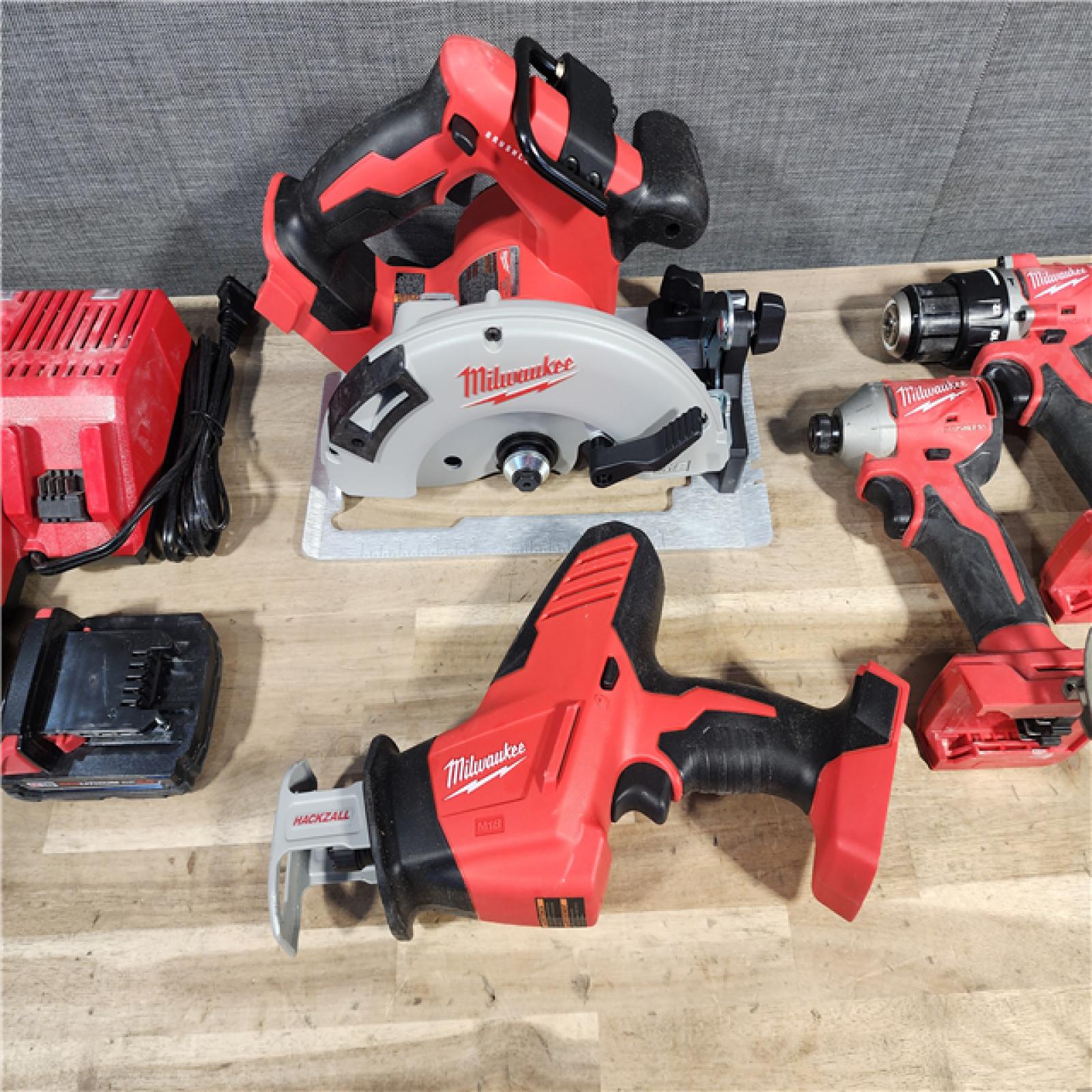 HOUSTON LOCATION - AS-IS Milwaukee M18 18-Volt Lithium-Ion Brushless Cordless Combo Kit (4-Tool) with 2-Batteries, 1-Charger and Tool Bag
