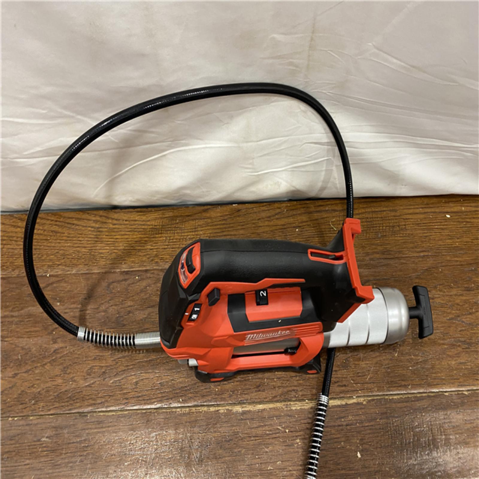 AS-IS Milwaukee Tool 10,000 PSI 14 Oz Battery-Operated Grease Gun - 48 Flexible Hose, 31 Strokes/oz | Part #2646-20