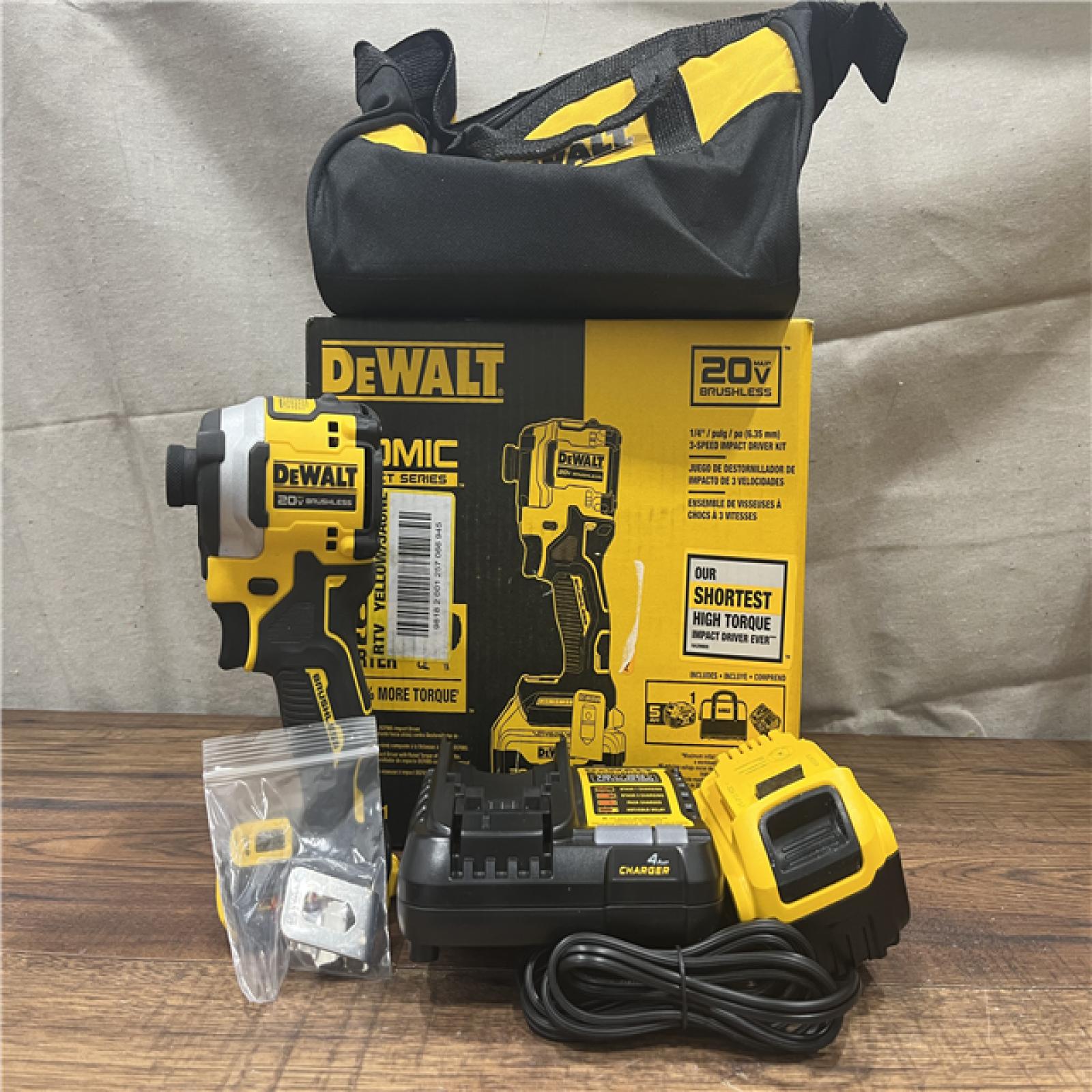 AS-IS DEWALT ATOMIC 20V MAX Lithium-Ion Cordless 1/4 in. Brushless Impact Driver Kit, 5 Ah Battery, Charger, and Bag