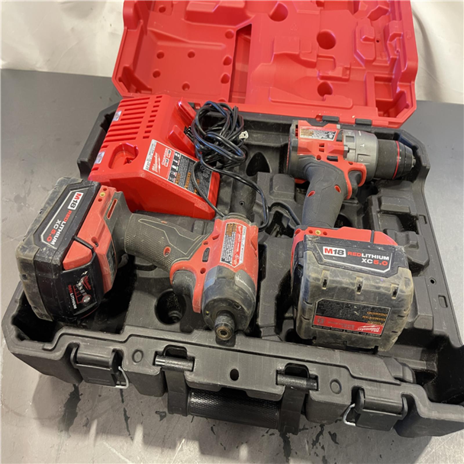 AS-IS - Milwaukee M18 FUEL 18V Lithium-Ion Brushless Cordless Hammer Drill and Impact Driver Combo Kit