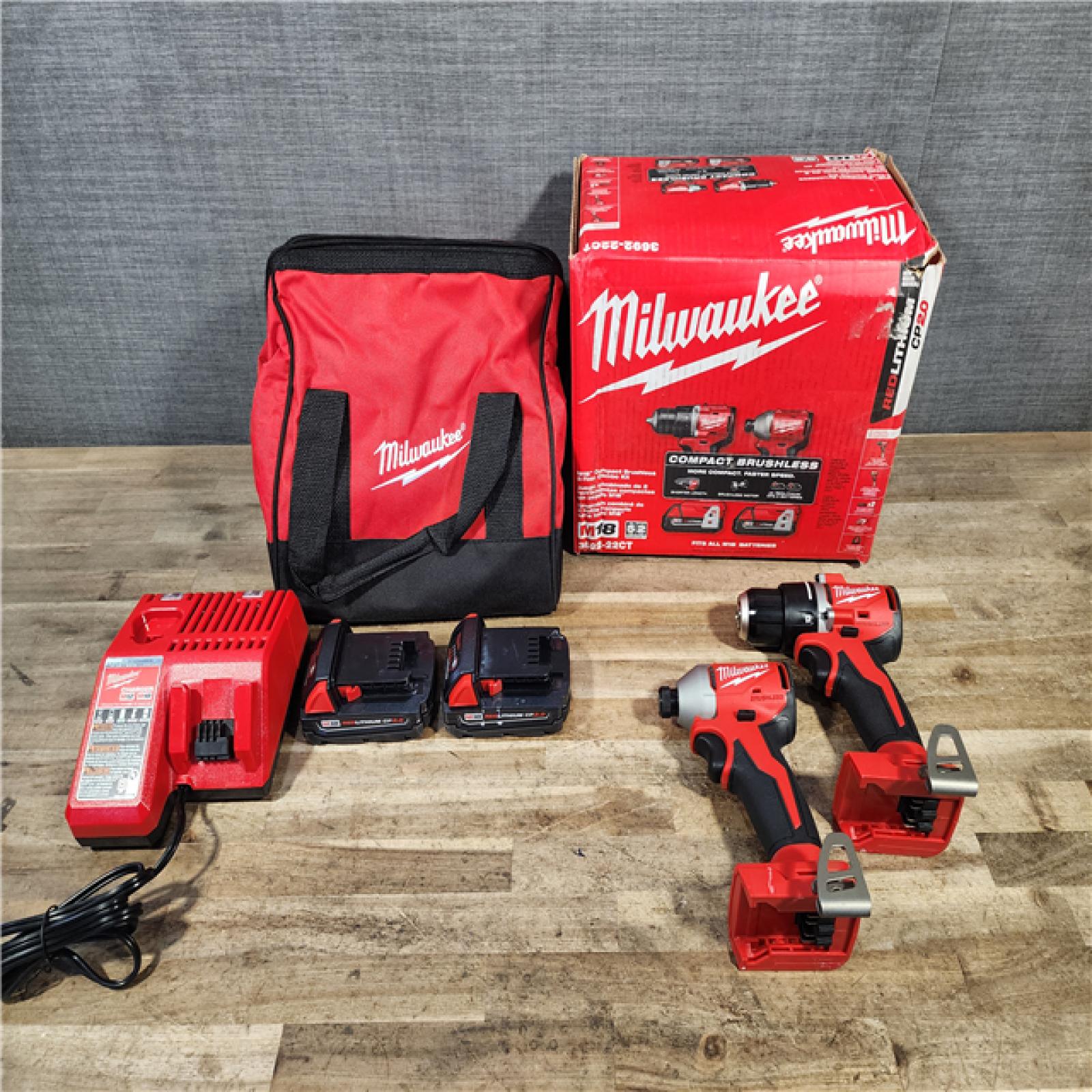 HOUSTON LOCATION - AS-IS Milwaukee M18 18V Lithium-Ion Brushless Cordless Compact Drill/Impact Combo Kit (2-Tool) W/(2) 2.0 Ah Batteries  Charger & Bag