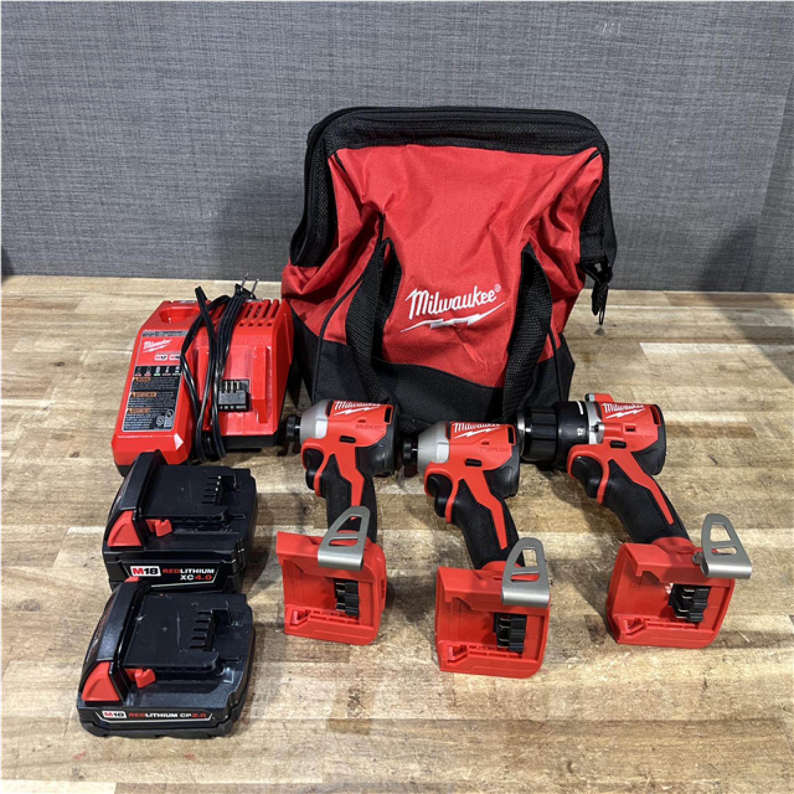 Houston Location AS-IS Milwaukee Drill Driver and Impact Drivers QTY/2 and Batteries QTY/2 with Charger
