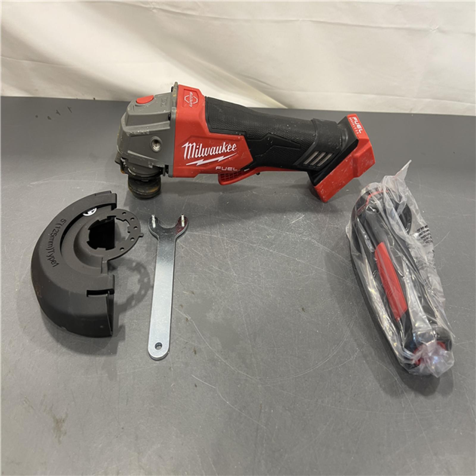 AS-IS - Milwaukee FUEL 18-Volt Lithium-Ion Brushless Cordless 4-1/2 in./5 in. Grinder W/Paddle Switch (Tool-Only)