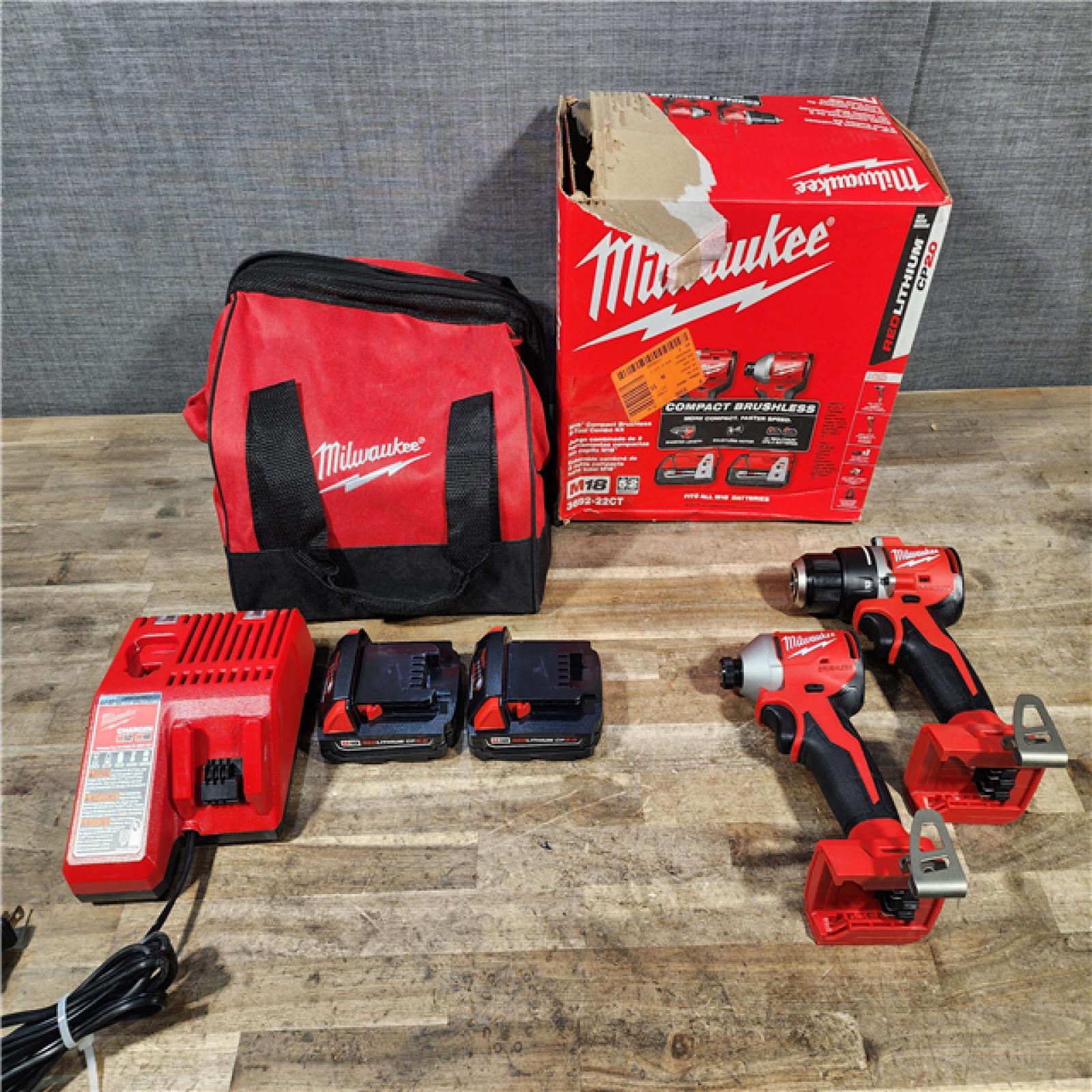 HOUSTON LOCATION - AS-IS Milwaukee M18 18V Lithium-Ion Brushless Cordless Compact Drill/Impact Combo Kit (2-Tool) W/(2) 2.0 Ah Batteries  Charger & Bag