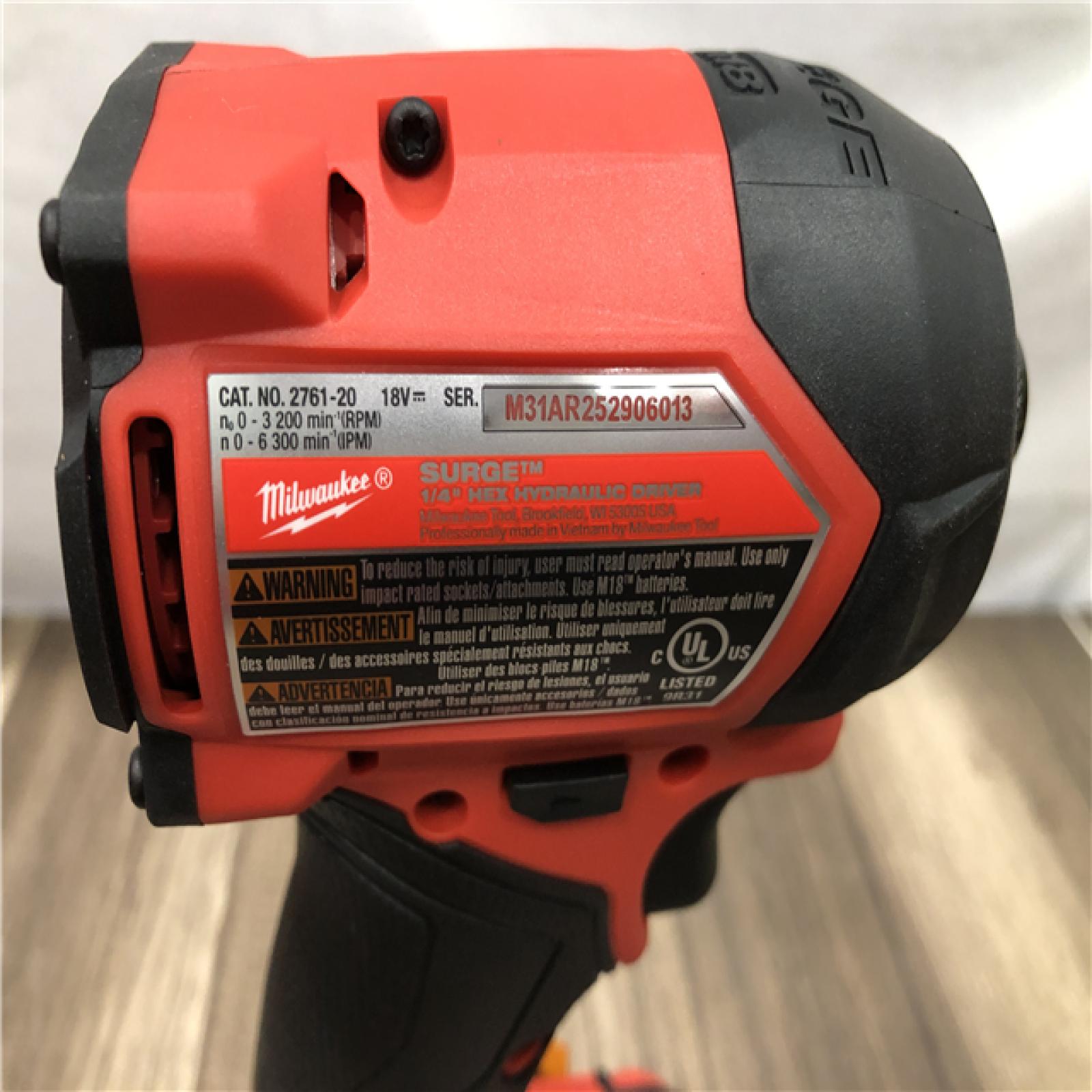 AS-IS Milwaukee FUEL SURGE 18V Lithium-Ion Brushless Cordless 1/4 in. Hex Impact Driver with (2) 5.0 Ah Battery and Charger