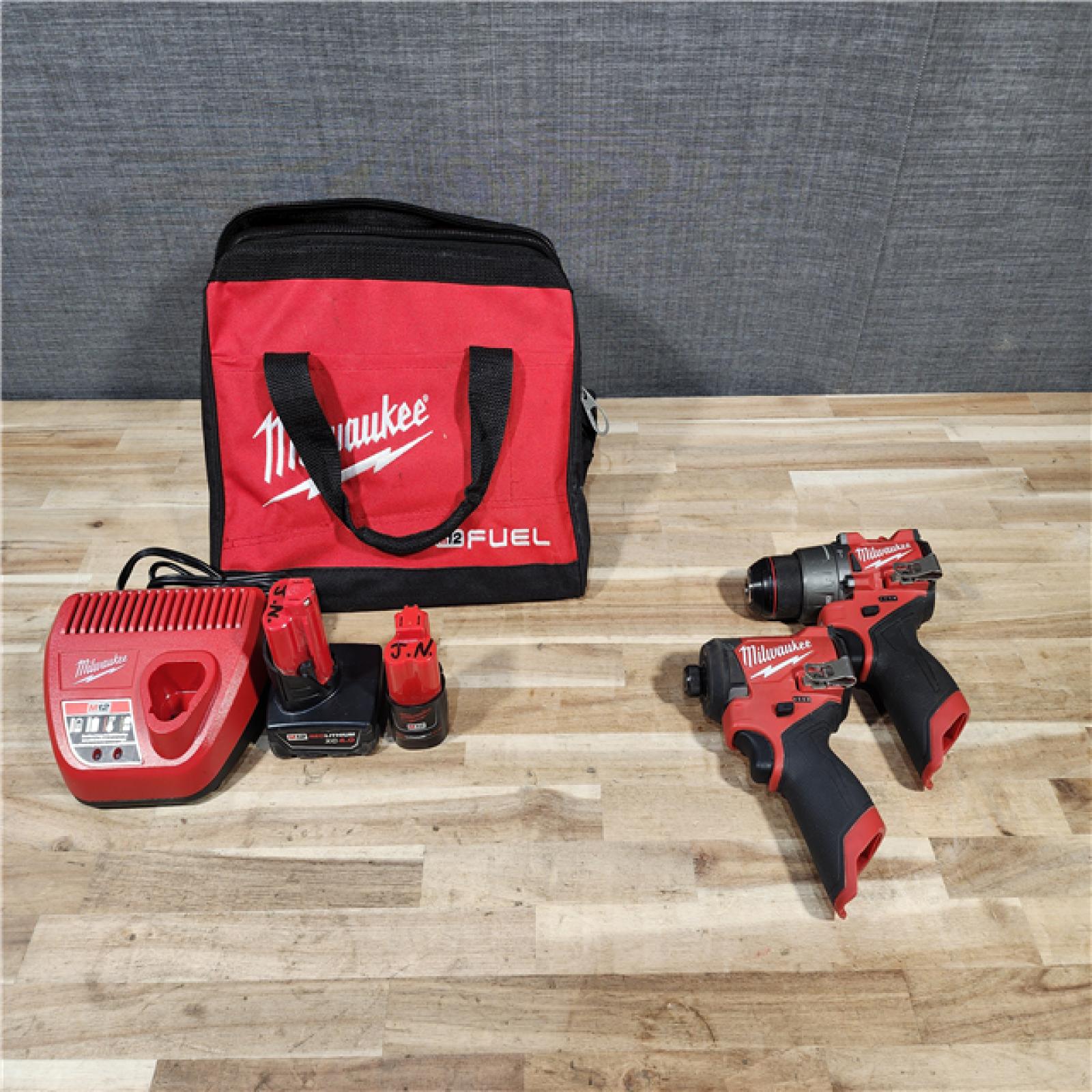 HOUSTON LOCATION - AS-IS Milwaukee FUEL 12-Volt Lithium-Ion Brushless Cordless Hammer Drill and Impact Driver Combo Kit
