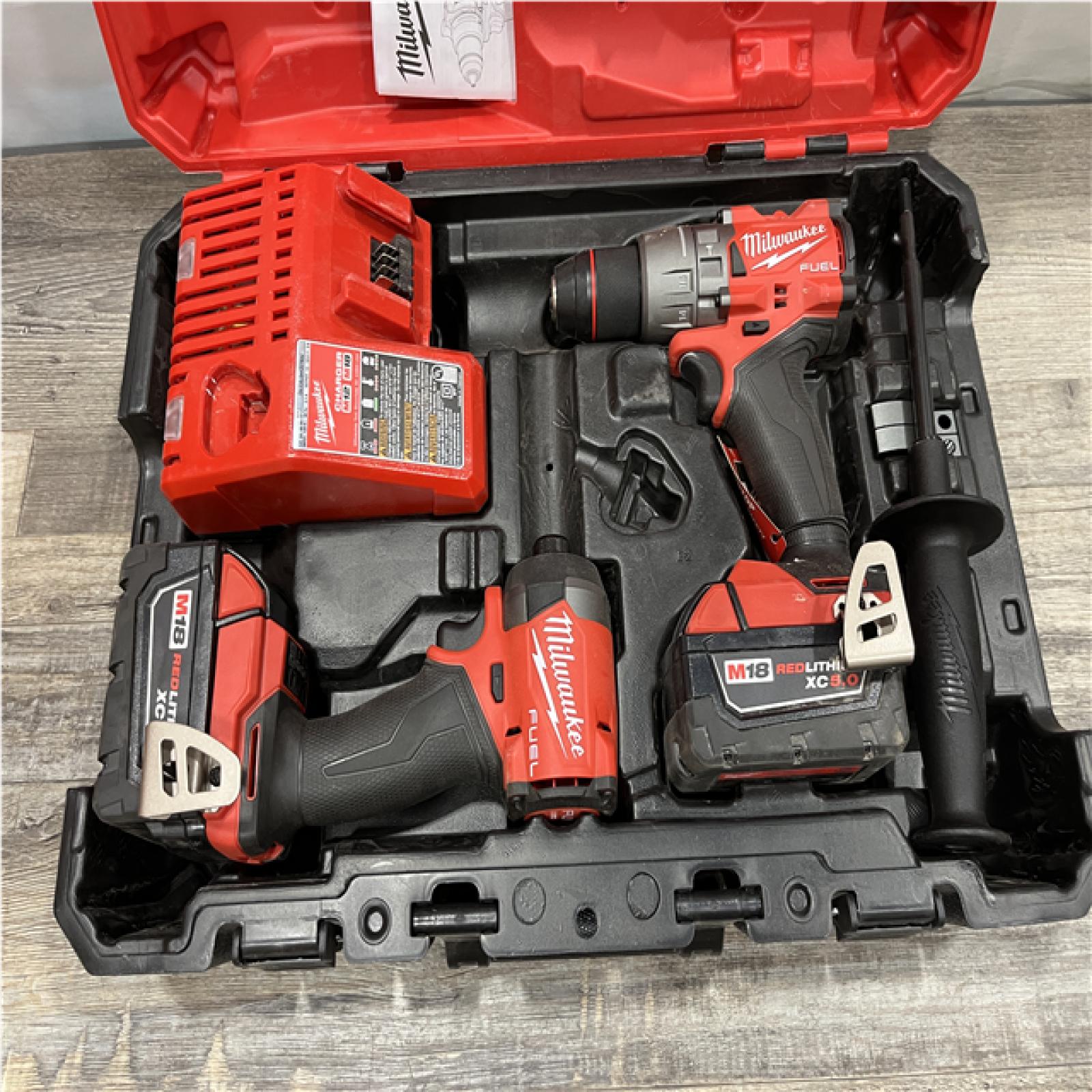 AS-IS Milwaukee FUEL 18V Lithium-Ion Brushless Cordless Hammer Drill and Impact Driver Combo Kit