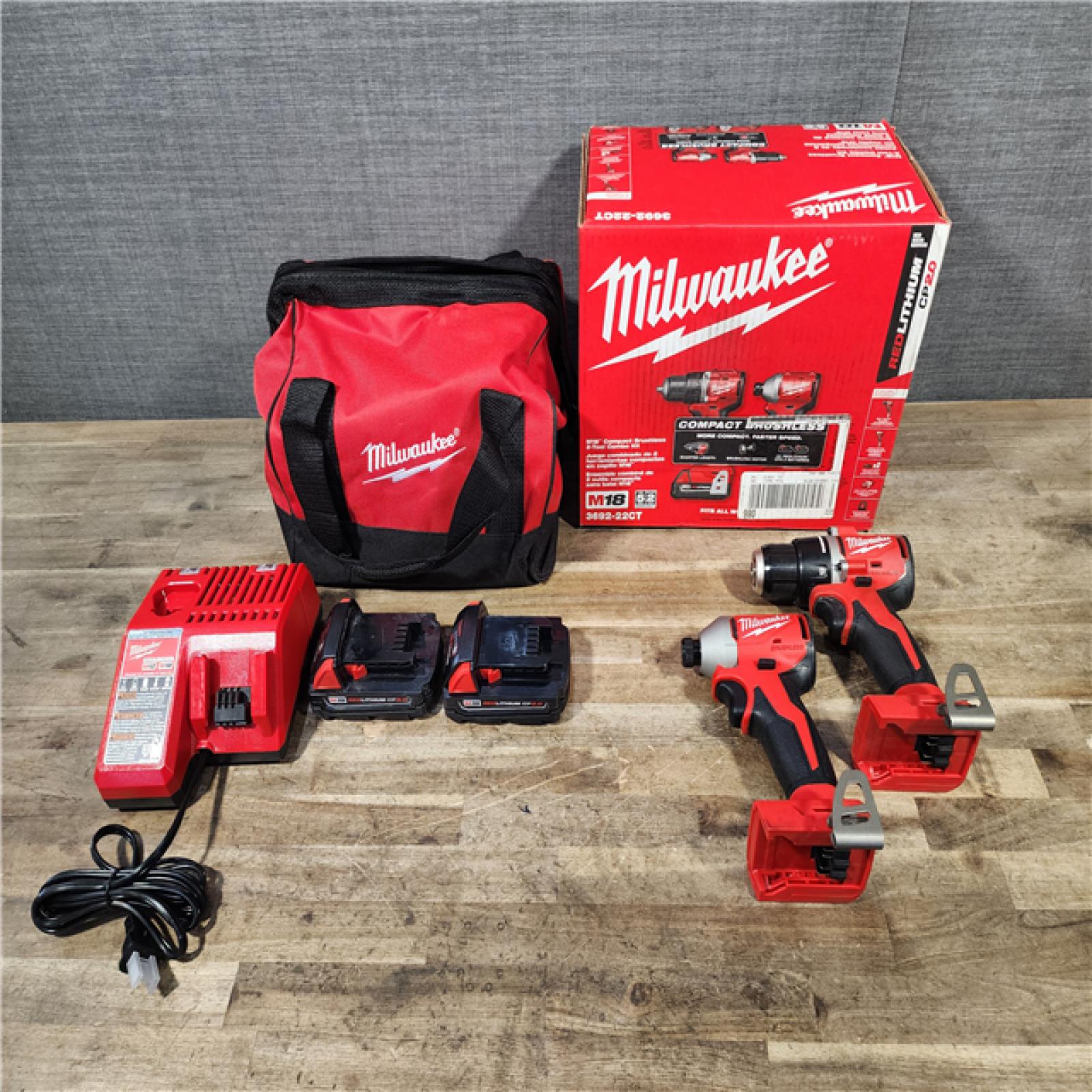 HOUSTON LOCATION - AS-IS Milwaukee M18 18V Lithium-Ion Brushless Cordless Compact Drill/Impact Combo Kit (2-Tool) W/(2) 2.0 Ah Batteries  Charger & Bag