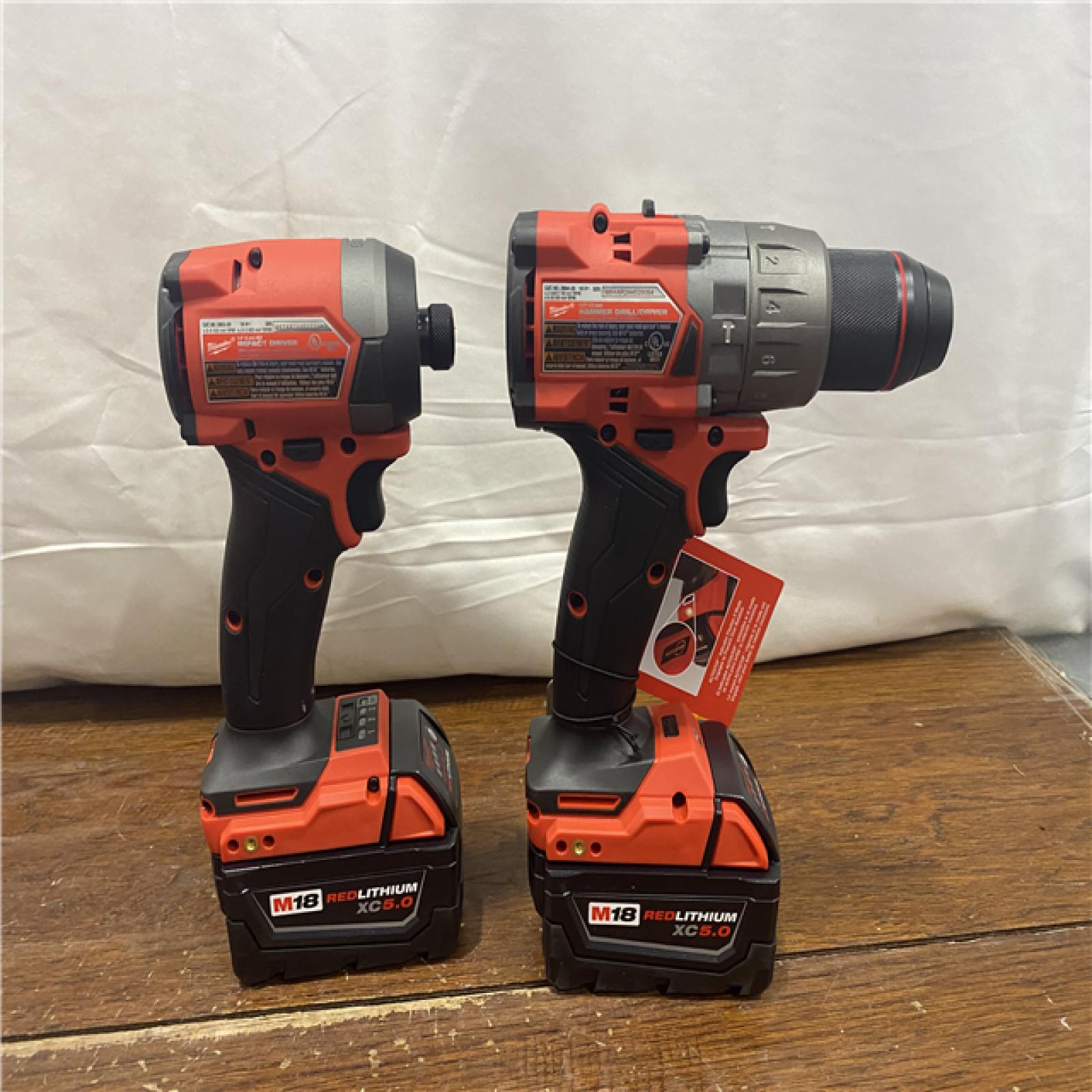 AS-IS MILWAUKEE M18 FUEL 18V Lithium-Ion Brushless Cordless Hammer Drill and Impact Driver Combo Kit (2-Tool) with 2 Batteries