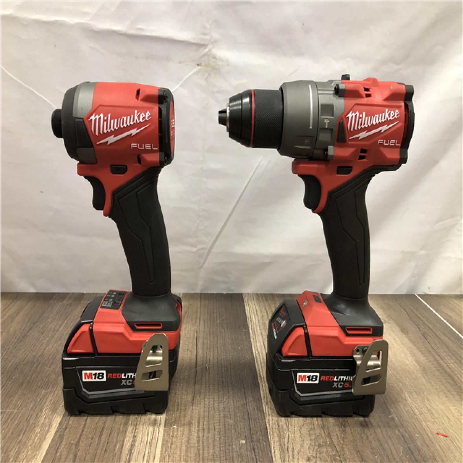 AS-IS Milwaukee FUEL 18V Lithium-Ion Brushless Cordless Hammer Drill and Impact Driver Combo Kit