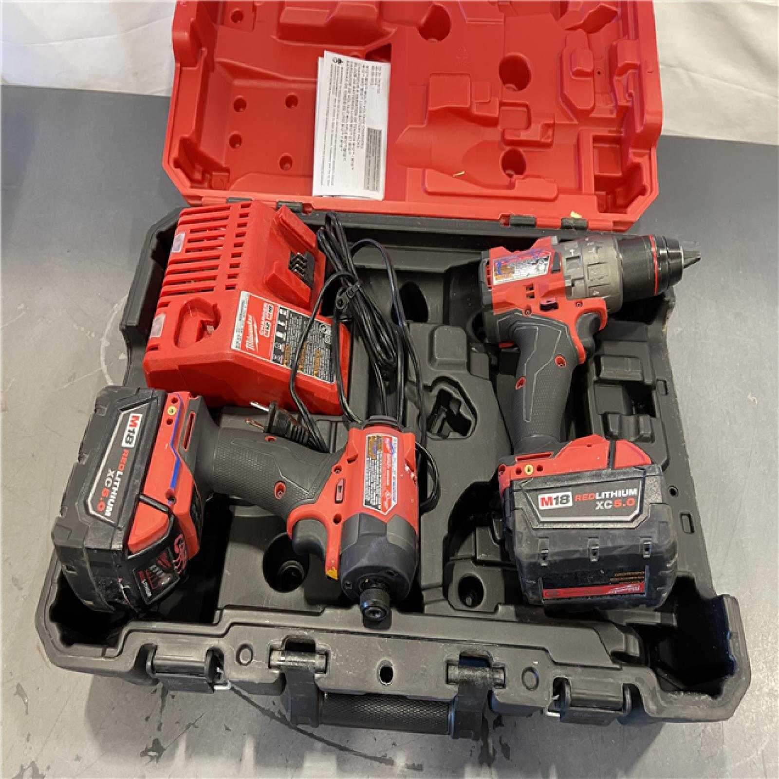 AS-IS- MILWAUKEE M18 FUEL 18V Lithium-Ion Brushless Cordless Hammer Drill and Impact Driver Combo Kit