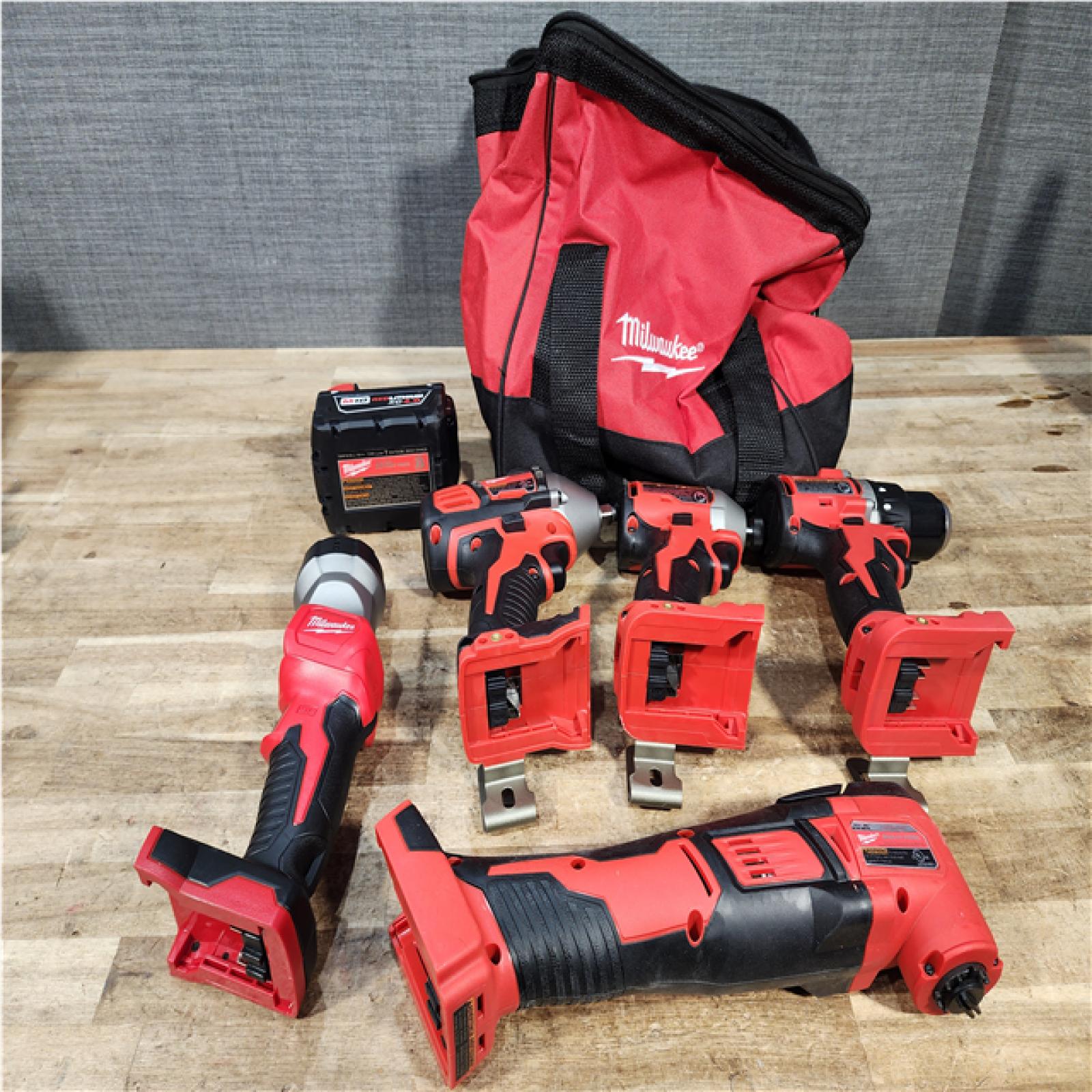 Houston Location AS-IS Milwaukee Drill and Impact Driver and Impact Wrench and Multitool and Work Light and Battery