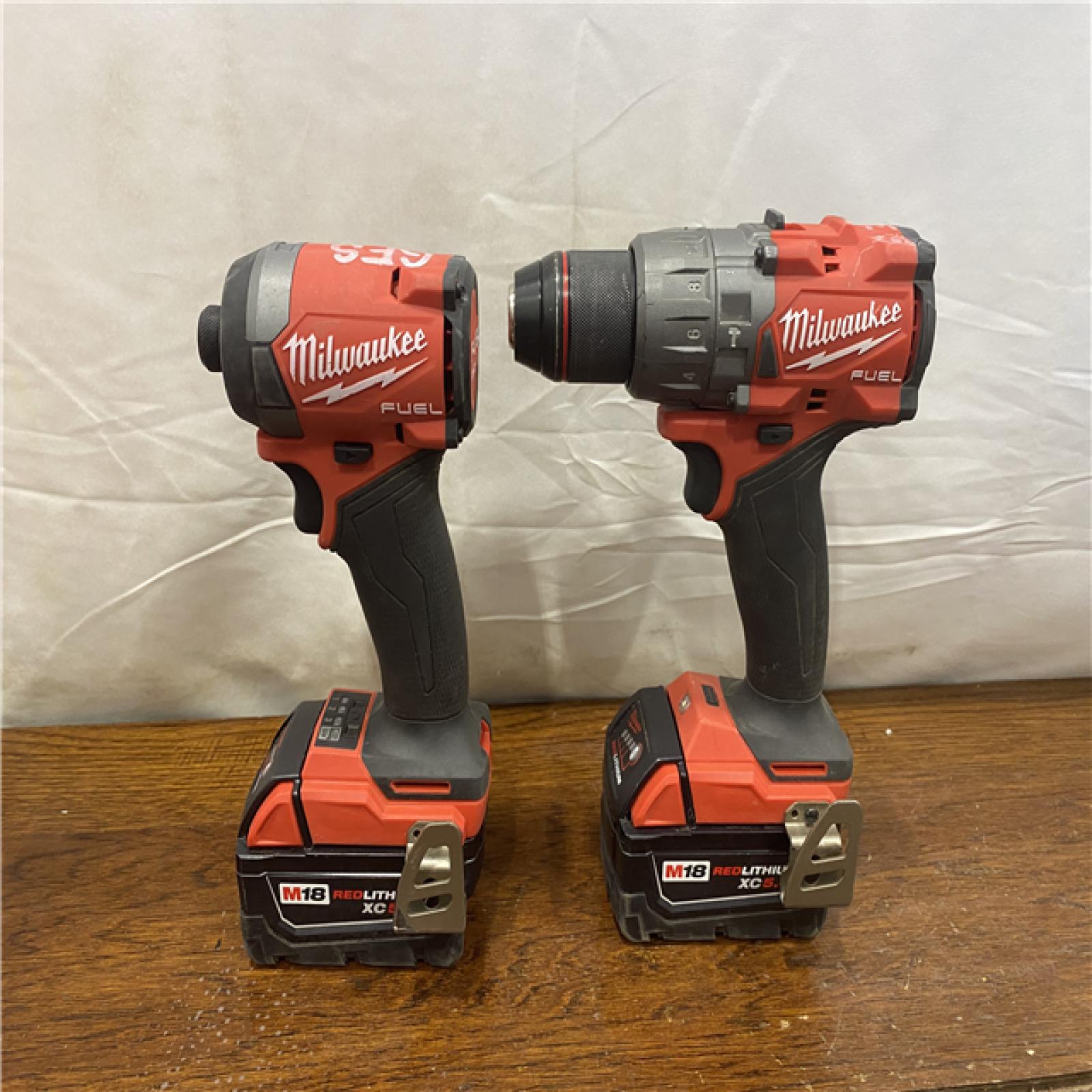 AS-IS MILWAUKEE M18 FUEL 18V Lithium-Ion Brushless Cordless Hammer Drill and Impact Driver Combo Kit (2-Tool) with 2 Batteries