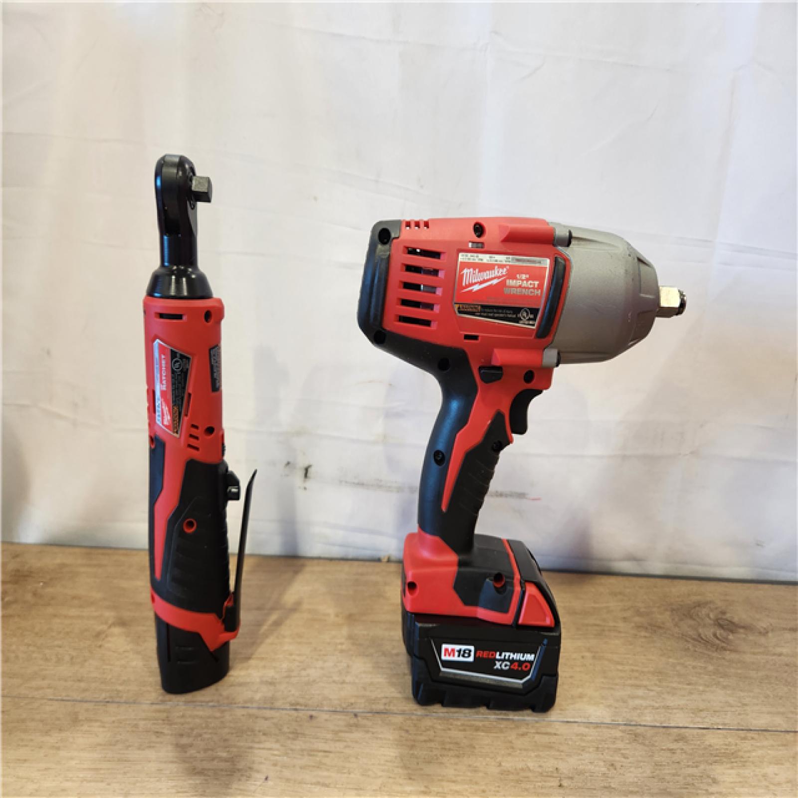 AS-IS- Milwaukee 12/18V Lithium-Ion Cordless 3/8 in. Ratchet and 1/2 in. High Torque Impact Wrench with Friction Ring Combo Kit