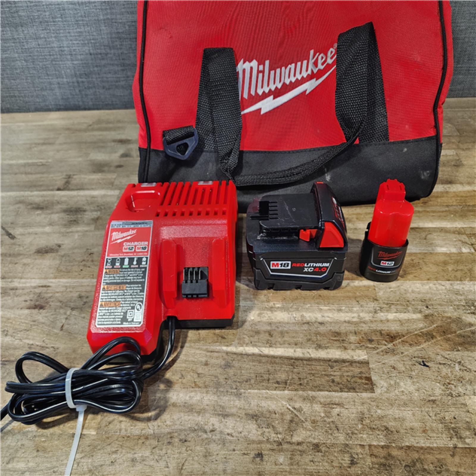 HOUSTON LOCATION - AS-IS Milwaukee 12/18V Lithium-Ion Cordless 3/8 in. Ratchet and 1/2 in. High Torque Impact Wrench with Friction Ring Combo Kit