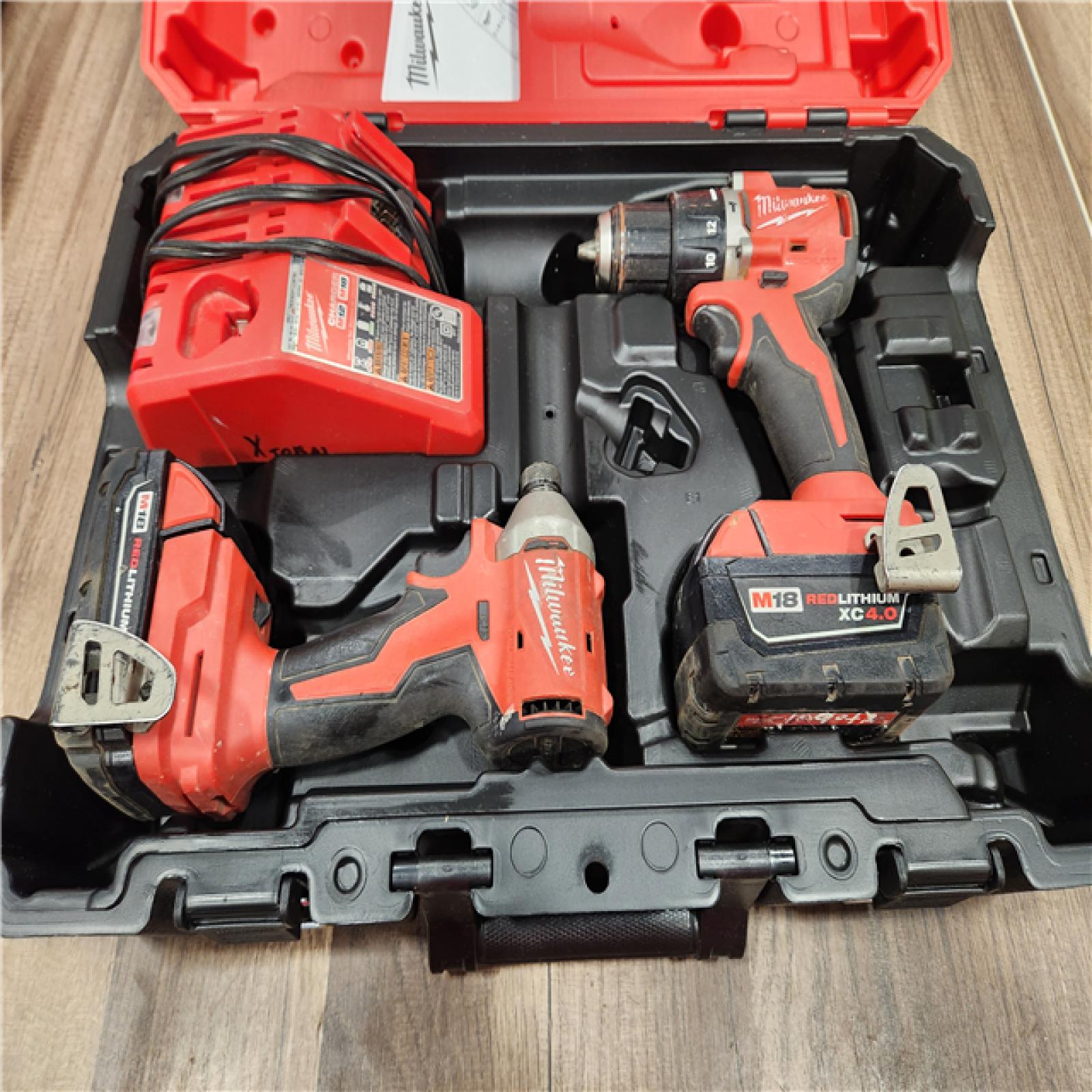 AS-IS Milwaukee M18 FUEL 18V Lithium-Ion Brushless Cordless Hammer Drill and Impact Driver Combo Kit (2-Tool) with 2 Batteries