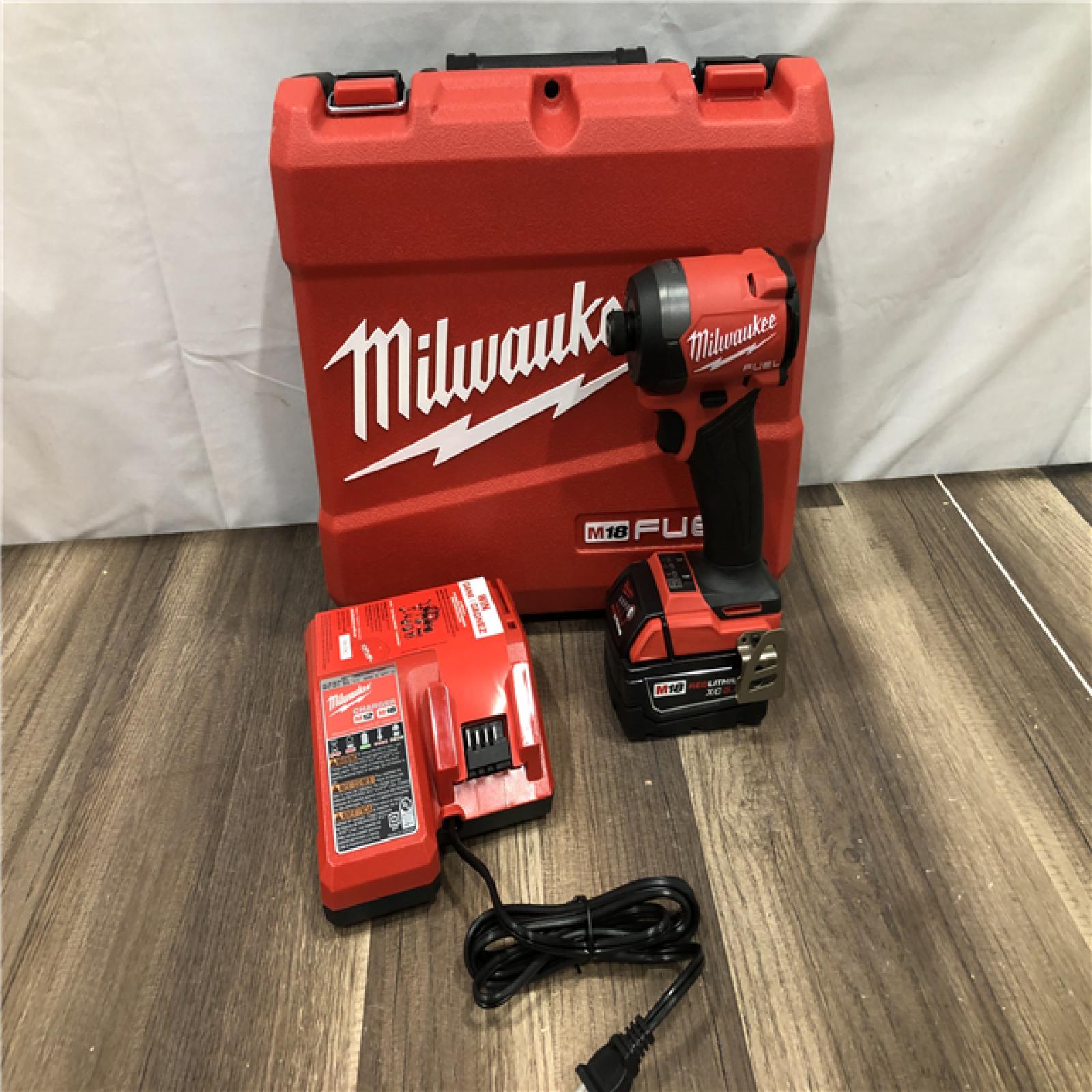 AS-IS Milwaukee  FUEL 18V Lithium-Ion Brushless Cordless 1/4 in. Hex Impact Driver Kit