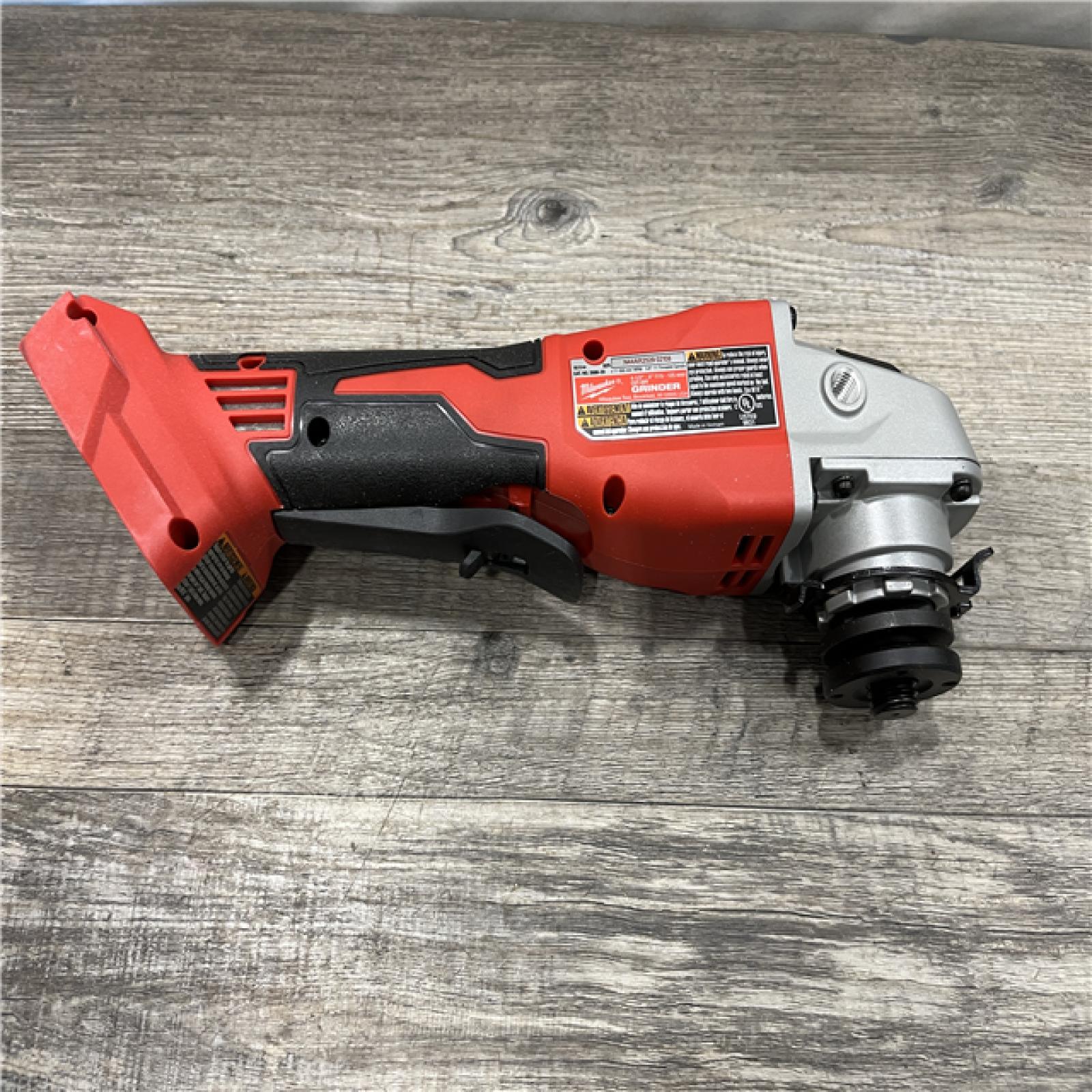 AS-IS Milwaukee 18V Lithium-Ion Brushless Cordless 4-1/2 in./5 in. Grinder w/Paddle Switch (Tool-Only)