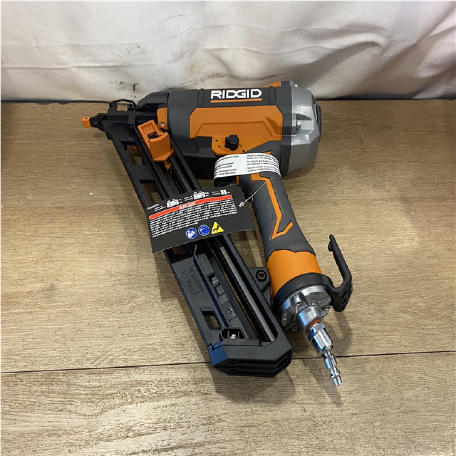 AS-IS Ridgid 15-Gauge 2-1/2 in. Angled Finish Nailer with CLEAN DRIVE Technology  Tool Bag and Sample Nails
