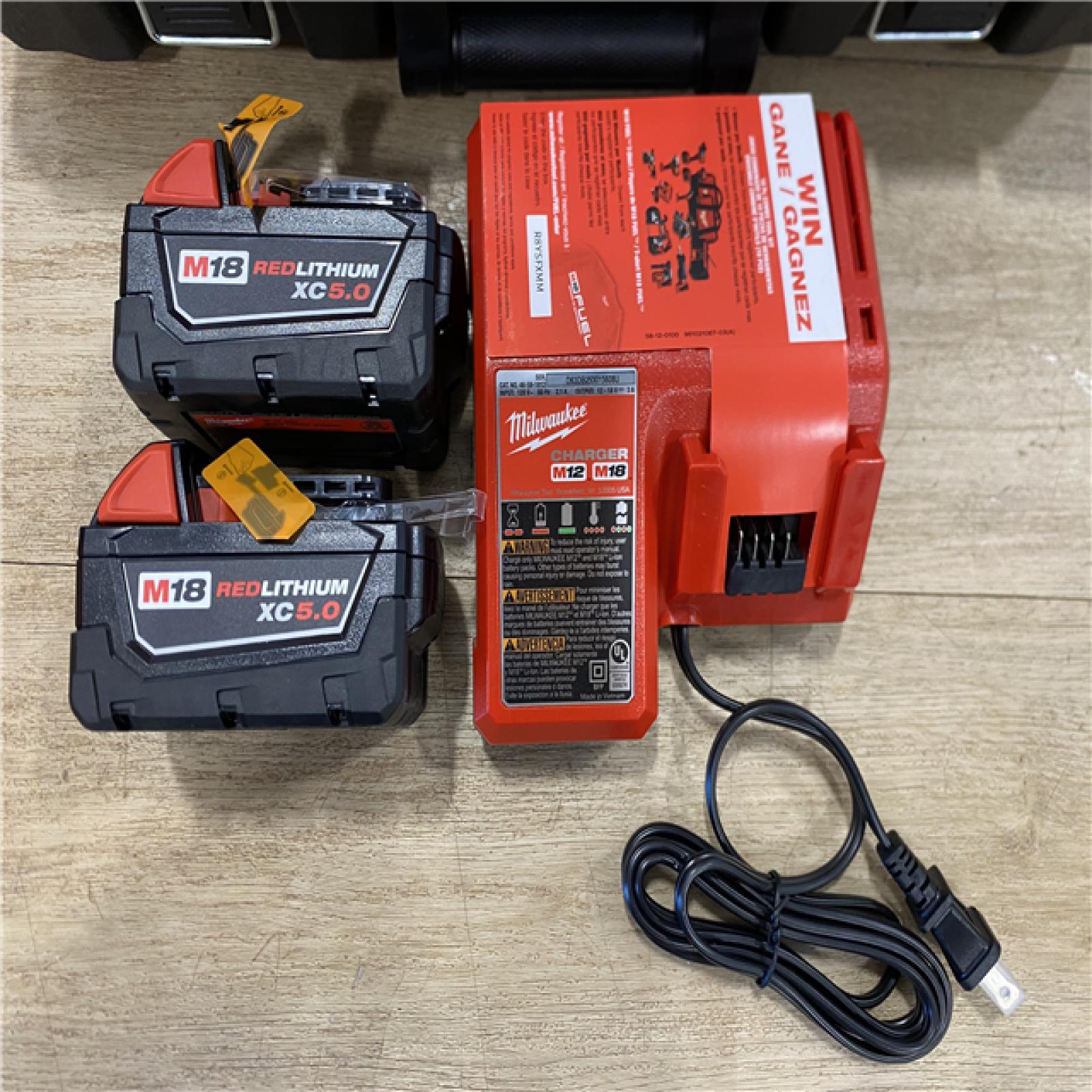AS-IS Milwaukee FUEL 18V Lithium-Ion Brushless Cordless Hammer Drill and Impact Driver Combo Kit