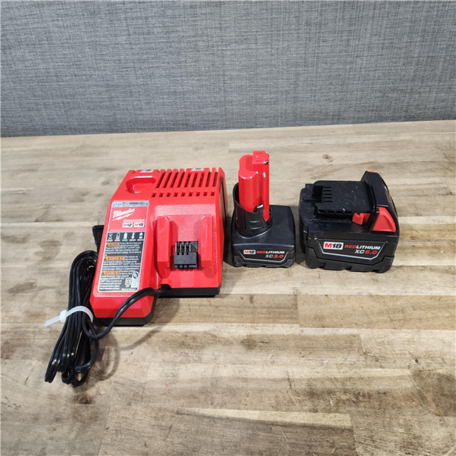 HOUSTON LOCATION - AS-IS MILWAUKEE 3 TOOL COMBO KIT W/ (2) BATTERY & CHARGER