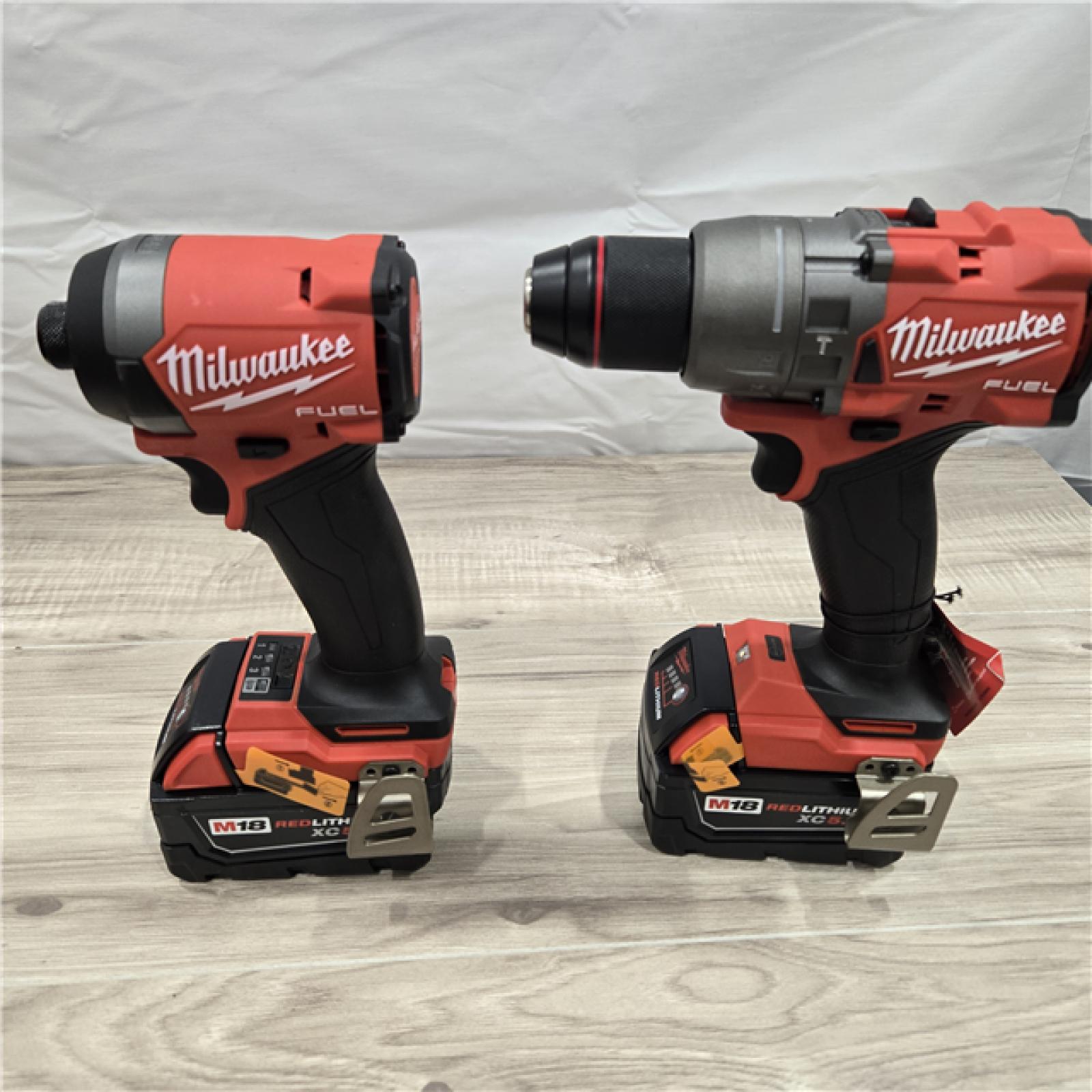 AS-IS MILWAUKEE FUEL 18V Lithium-Ion Brushless Cordless Hammer Drill and Impact Driver Combo Kit (2-Tool) with 2 Batteries