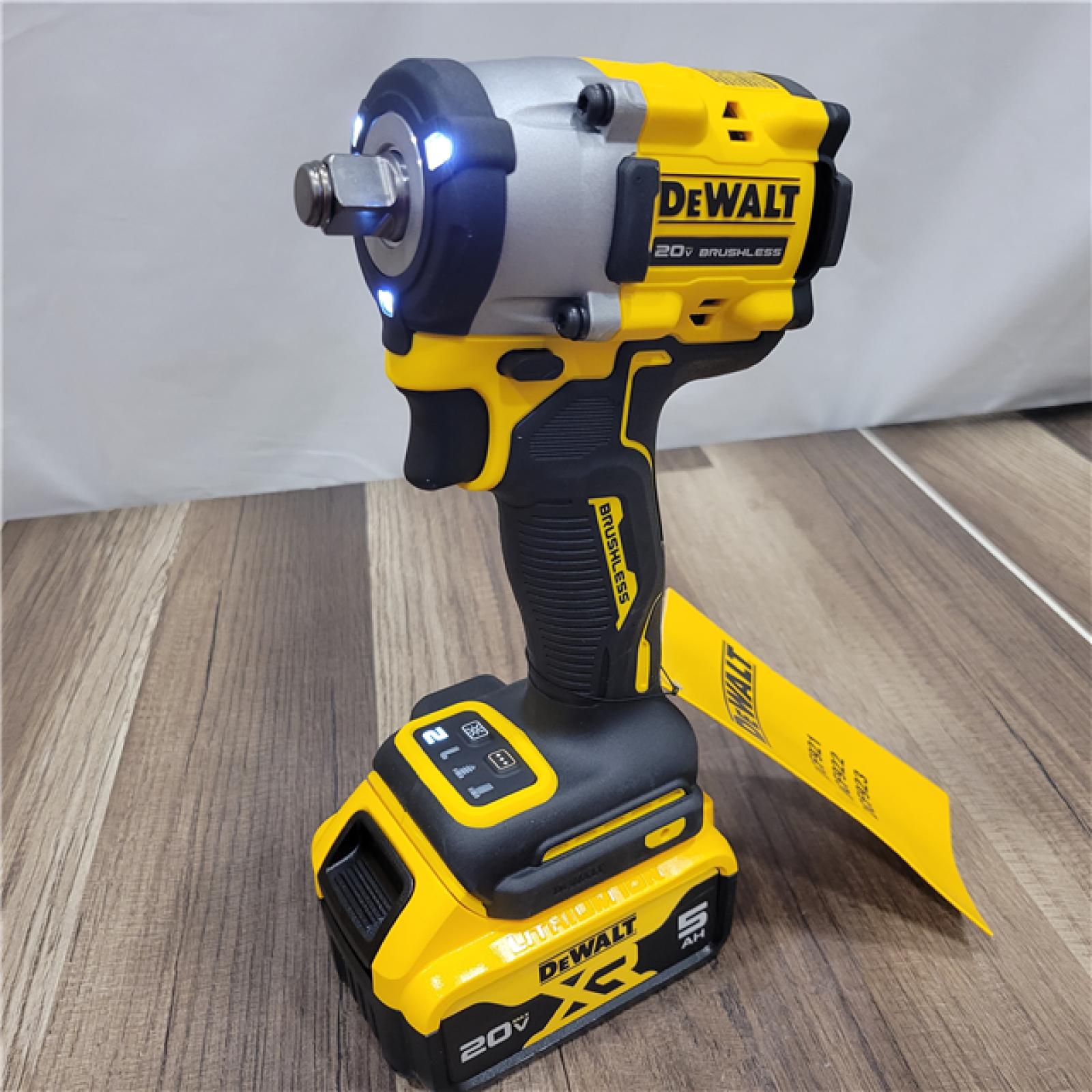 LIKE NEW! DEWALT ATOMIC 20V MAX Lithium-Ion Brushless Cordless 1/2 in. Variable Speed Impact Wrench Kit with 5 Ah Battery and Charger