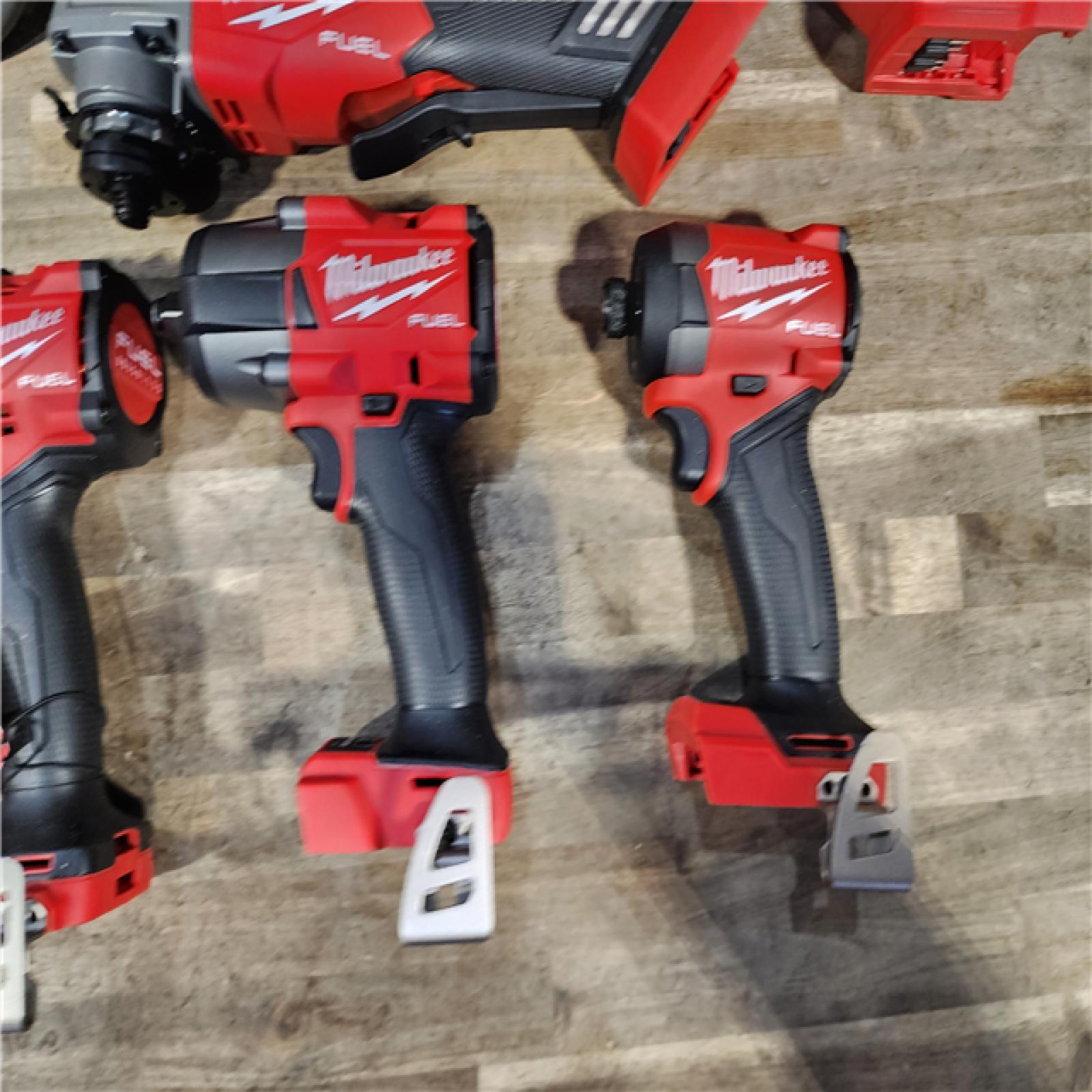 HOUSTON LOCATION - AS-IS (APPEARS LIKE NEW) Milwaukee M18 FUEL 18V Lithium-Ion Brushless Cordless Combo Kit with Two 5.0 Ah Batteries  1 Charger  2 Tool Bags (7-Tool)