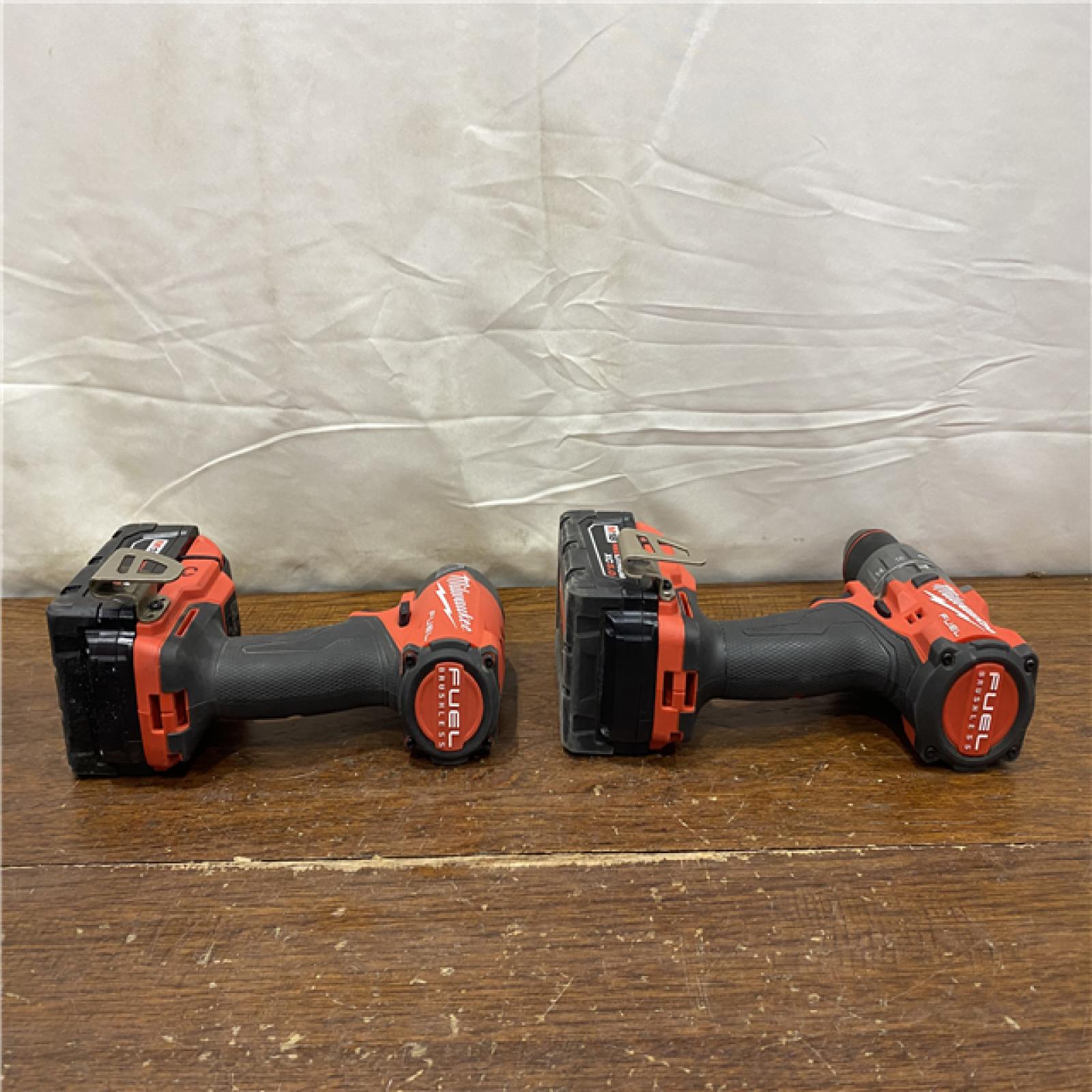 AS-IS MILWAUKEE M18 FUEL 18V Lithium-Ion Brushless Cordless Hammer Drill and Impact Driver Combo Kit (2-Tool) with 2 Batteries