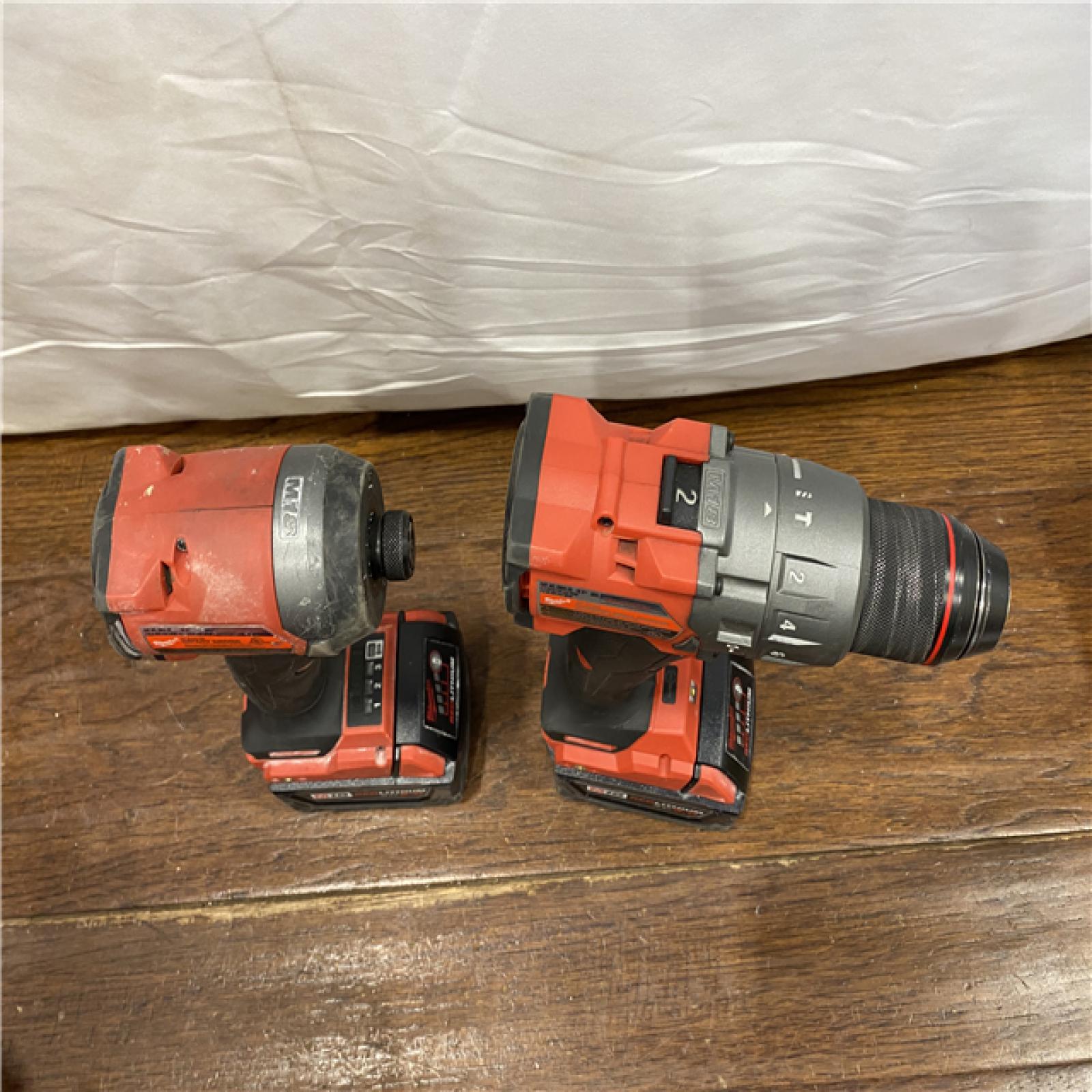 AS-IS MILWAUKEE M18 FUEL 18V Lithium-Ion Brushless Cordless Hammer Drill and Impact Driver Combo Kit (2-Tool) with 2 Batteries