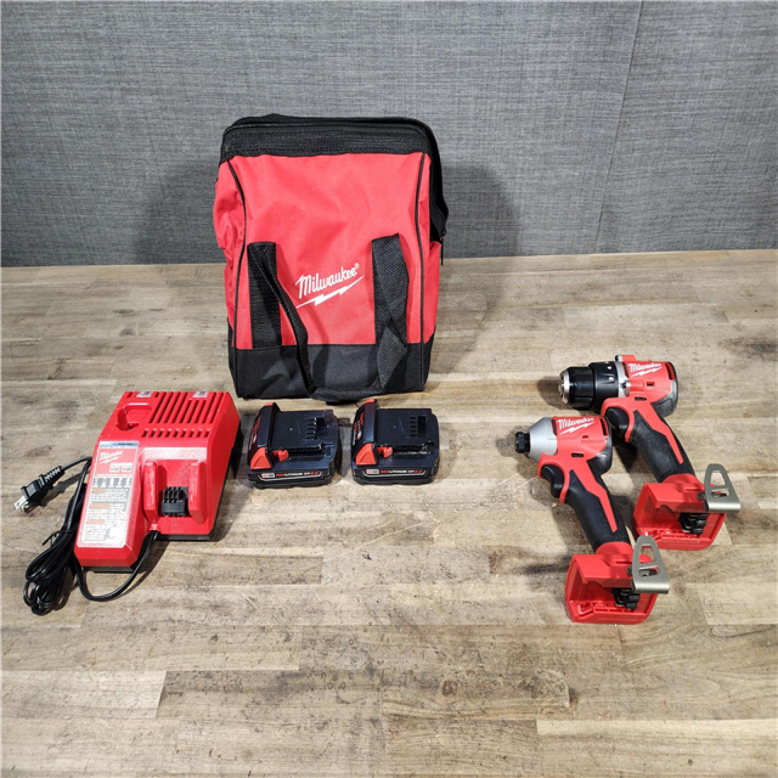 HOUSTON LOCATION - AS-IS Milwaukee M18 18V Lithium-Ion Brushless Cordless Compact Drill/Impact Combo Kit (2-Tool) W/(2) 2.0 Ah Batteries  Charger & Bag