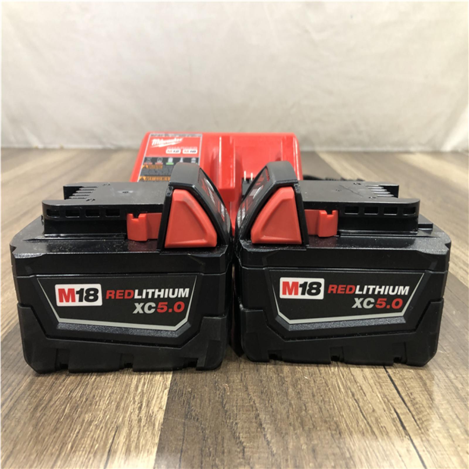 AS-IS Milwaukee 18-Volt Lithium-Ion XC Starter Kit with (2) 5.0Ah Batteries and Charger