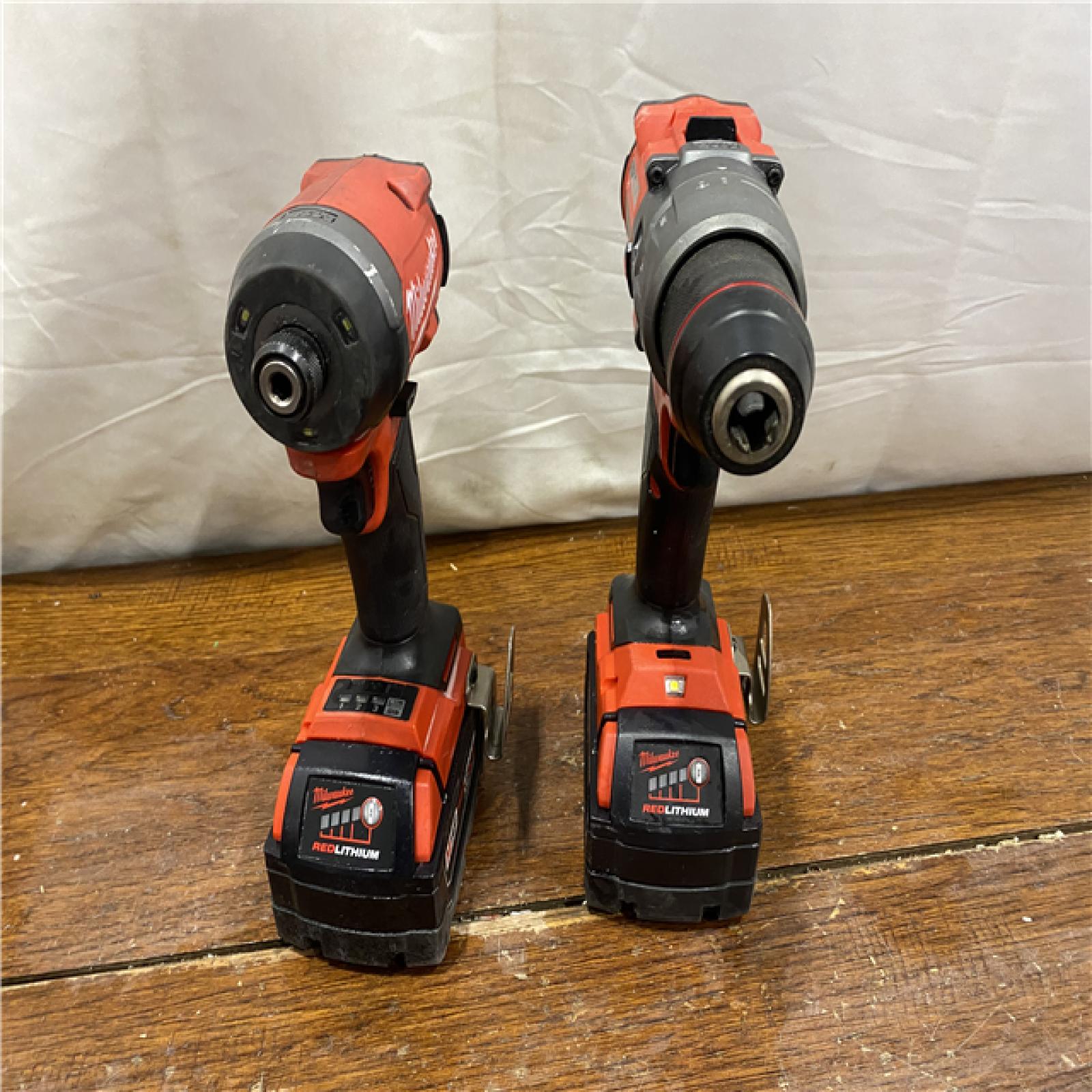 AS-IS MILWAUKEE M18 FUEL 18V Lithium-Ion Brushless Cordless Hammer Drill and Impact Driver Combo Kit (2-Tool) with 2 Batteries