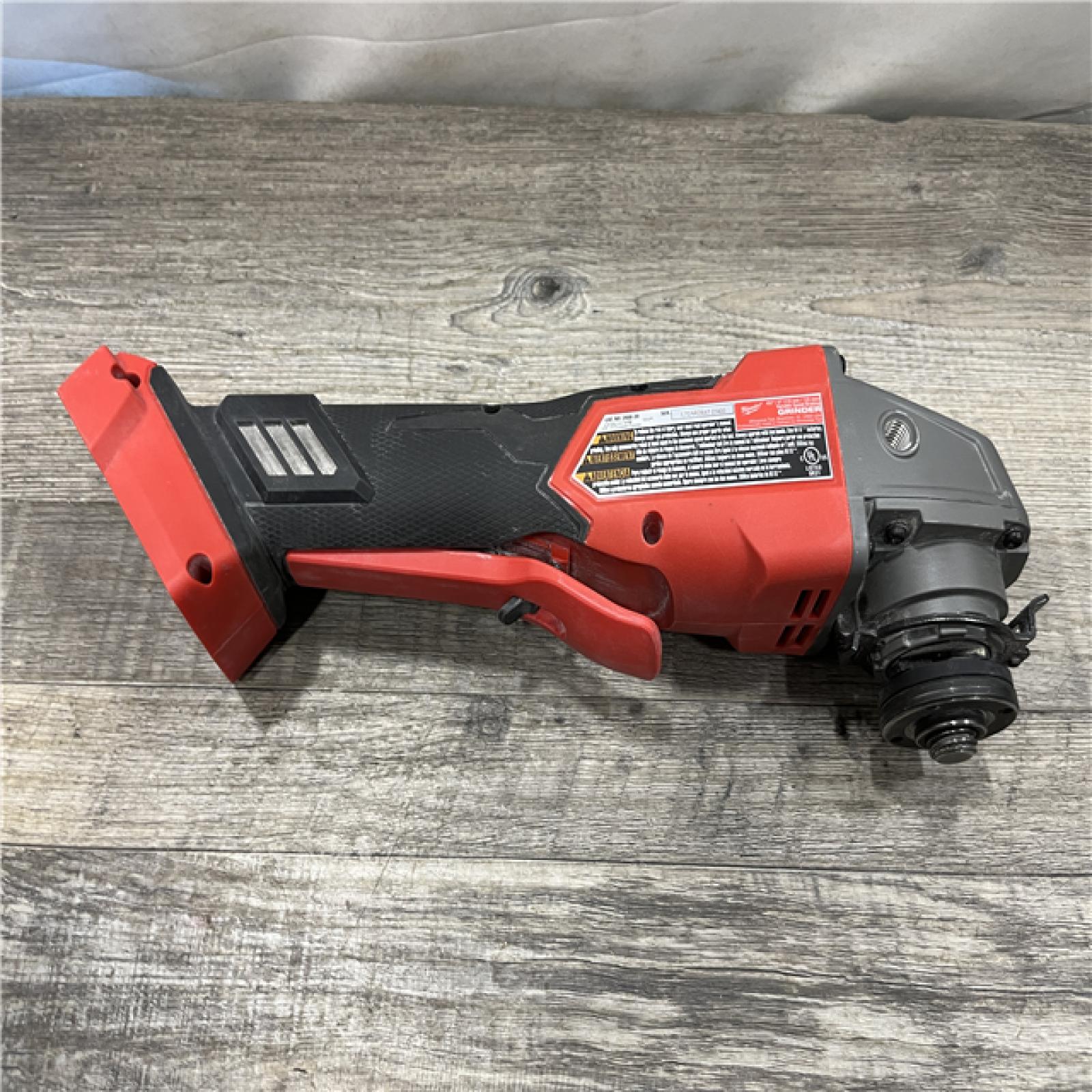 AS-IS Milwaukee FUEL 18V Lithium-Ion Brushless Cordless 4-1/2 in./5 in. Grinder with Variable Speed & Paddle Switch (Tool-Only)
