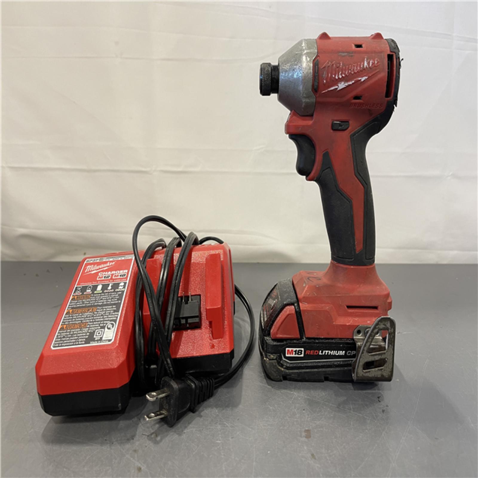 AS-IS - Milwaukee M18 18-Volt Lithium-Ion Compact Brushless Cordless 1/4 in. Impact Driver Kit