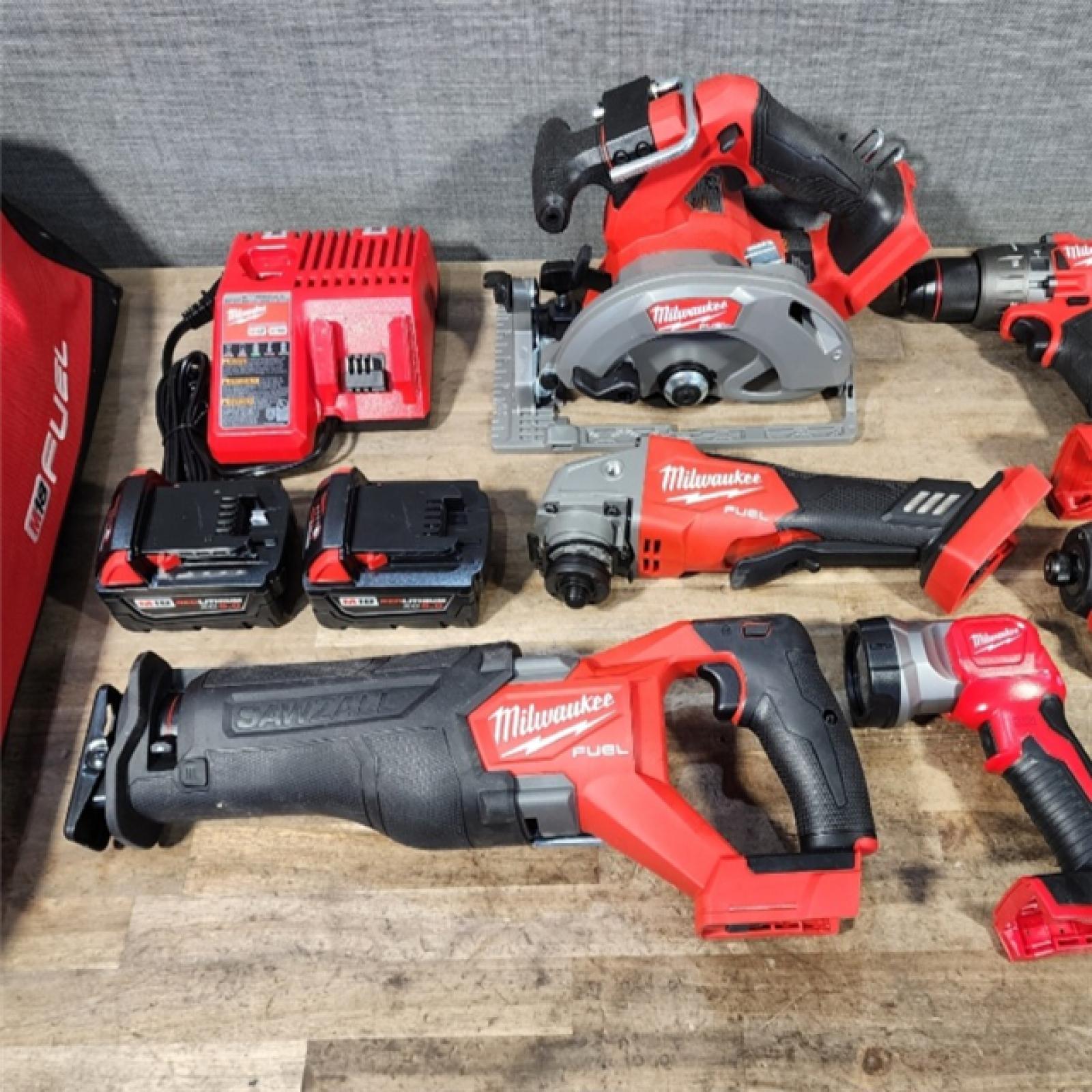 HOUSTON LOCATION - AS-IS Milwaukee M18 FUEL 18V Lithium-Ion Brushless Cordless Combo Kit with Two 5.0 Ah Batteries  1 Charger  2 Tool Bags (7-Tool)