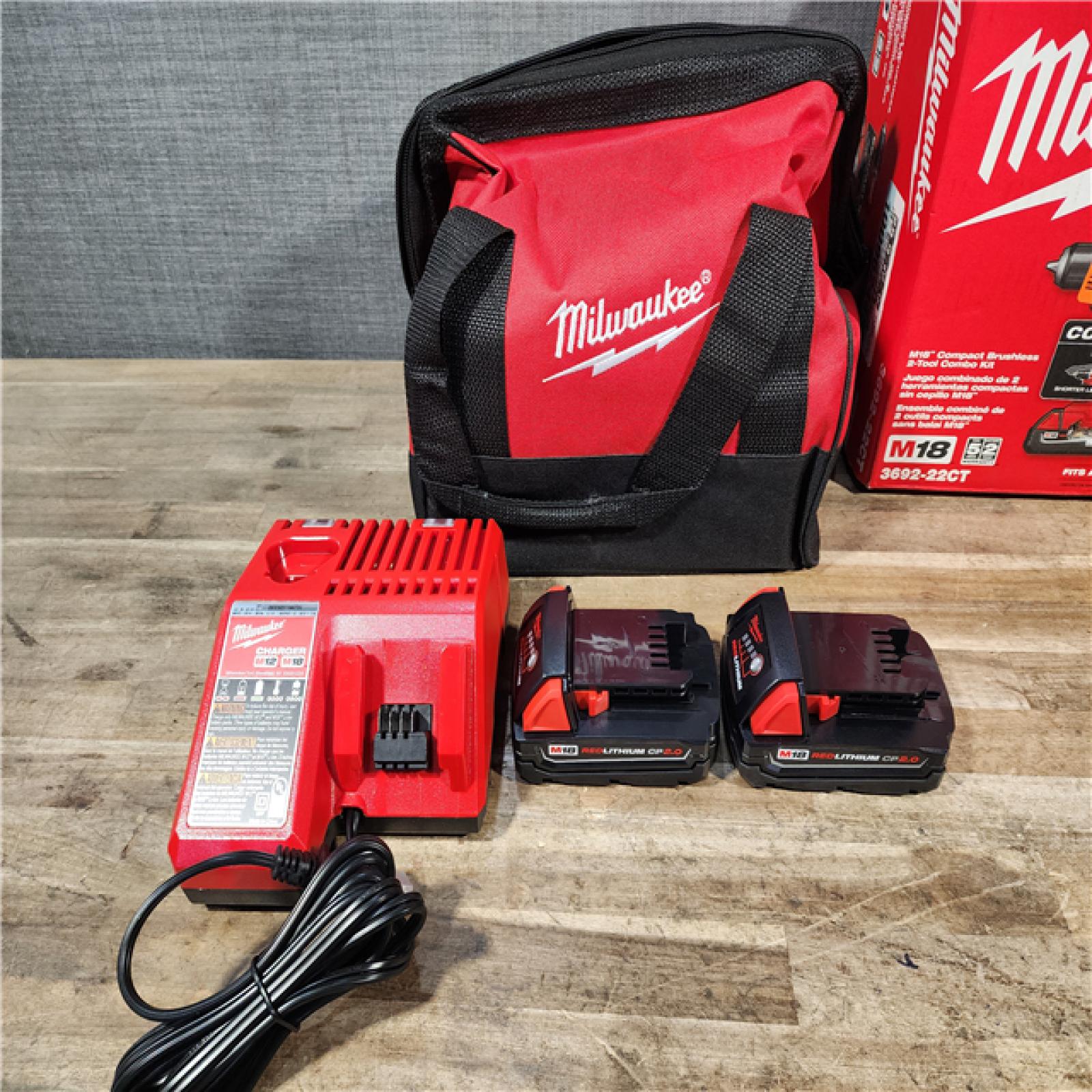 HOUSTON LOCATION - AS-IS Milwaukee M18 18V Lithium-Ion Brushless Cordless Compact Drill/Impact Combo Kit (2-Tool) W/(2) 2.0 Ah Batteries  Charger & Bag
