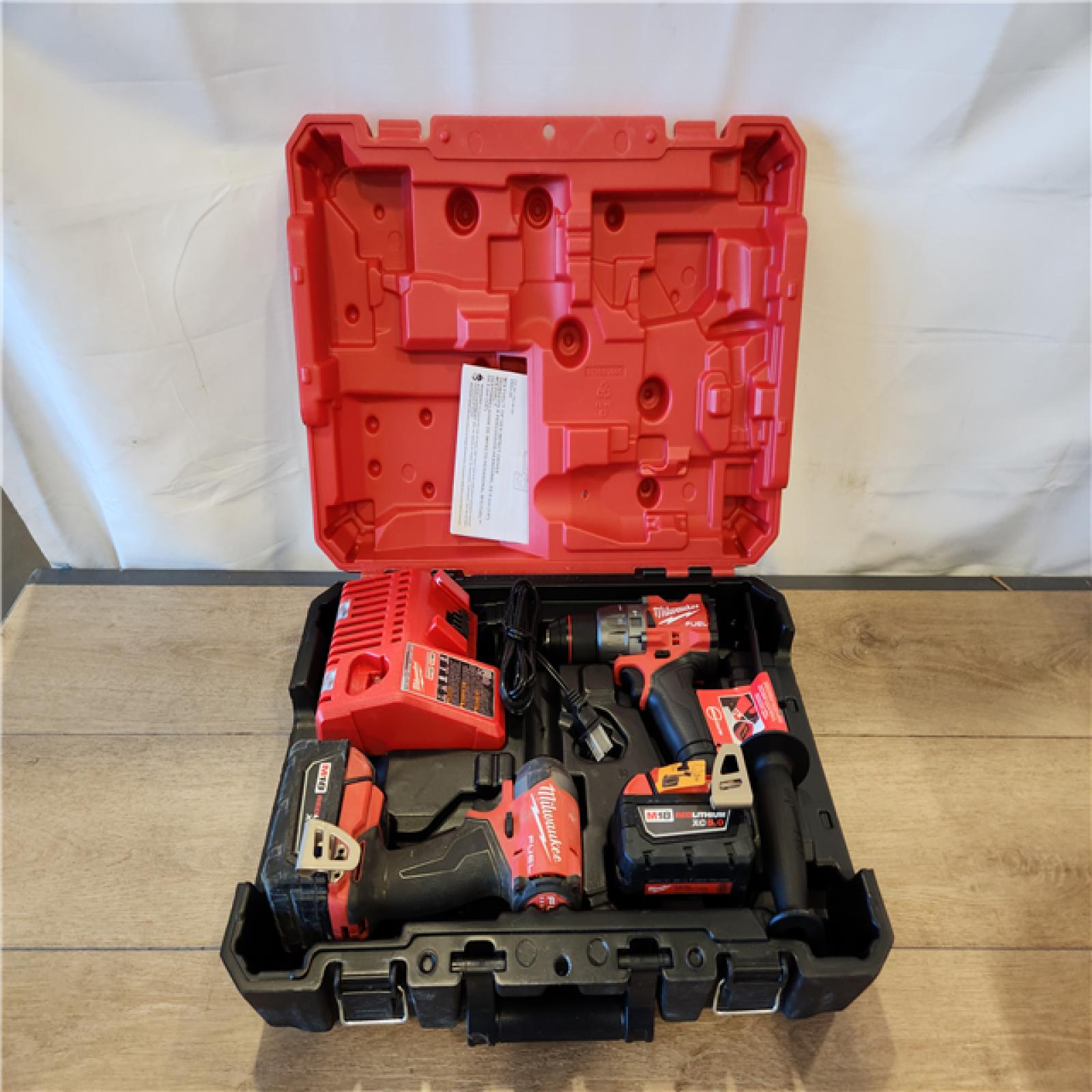 AS-IS- Milwaukee  FUEL 18V Lithium-Ion Brushless Cordless Hammer Drill and Impact Driver Combo Kit