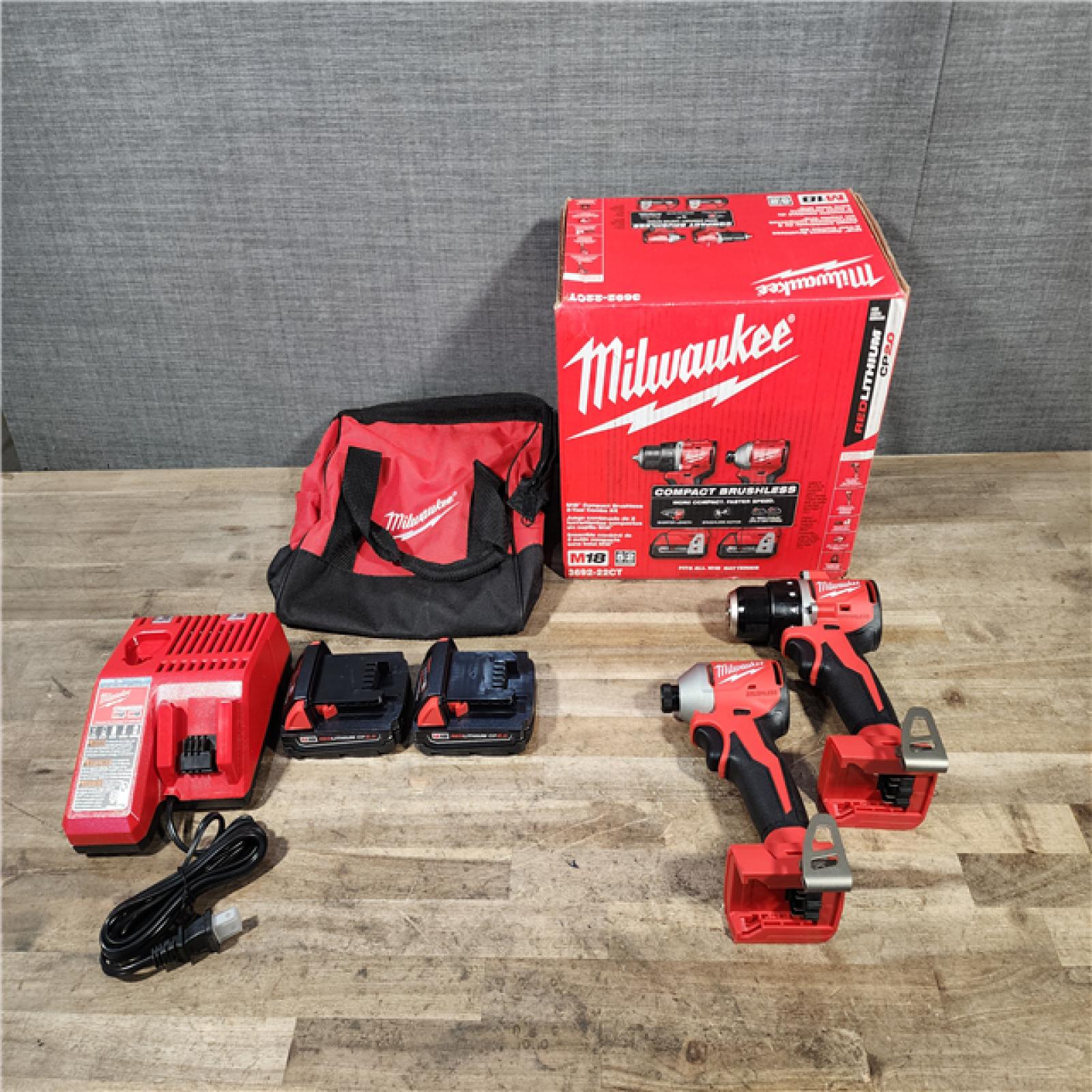 HOUSTON LOCATION - AS-IS Milwaukee M18 18V Lithium-Ion Brushless Cordless Compact Drill/Impact Combo Kit (2-Tool) W/(2) 2.0 Ah Batteries  Charger & Bag