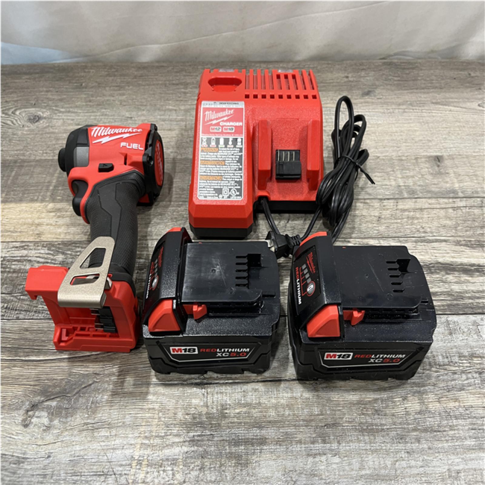 AS-IS Milwaukee FUEL 18V Lithium-Ion Brushless Cordless 1/4 in. Hex Impact Driver Kit