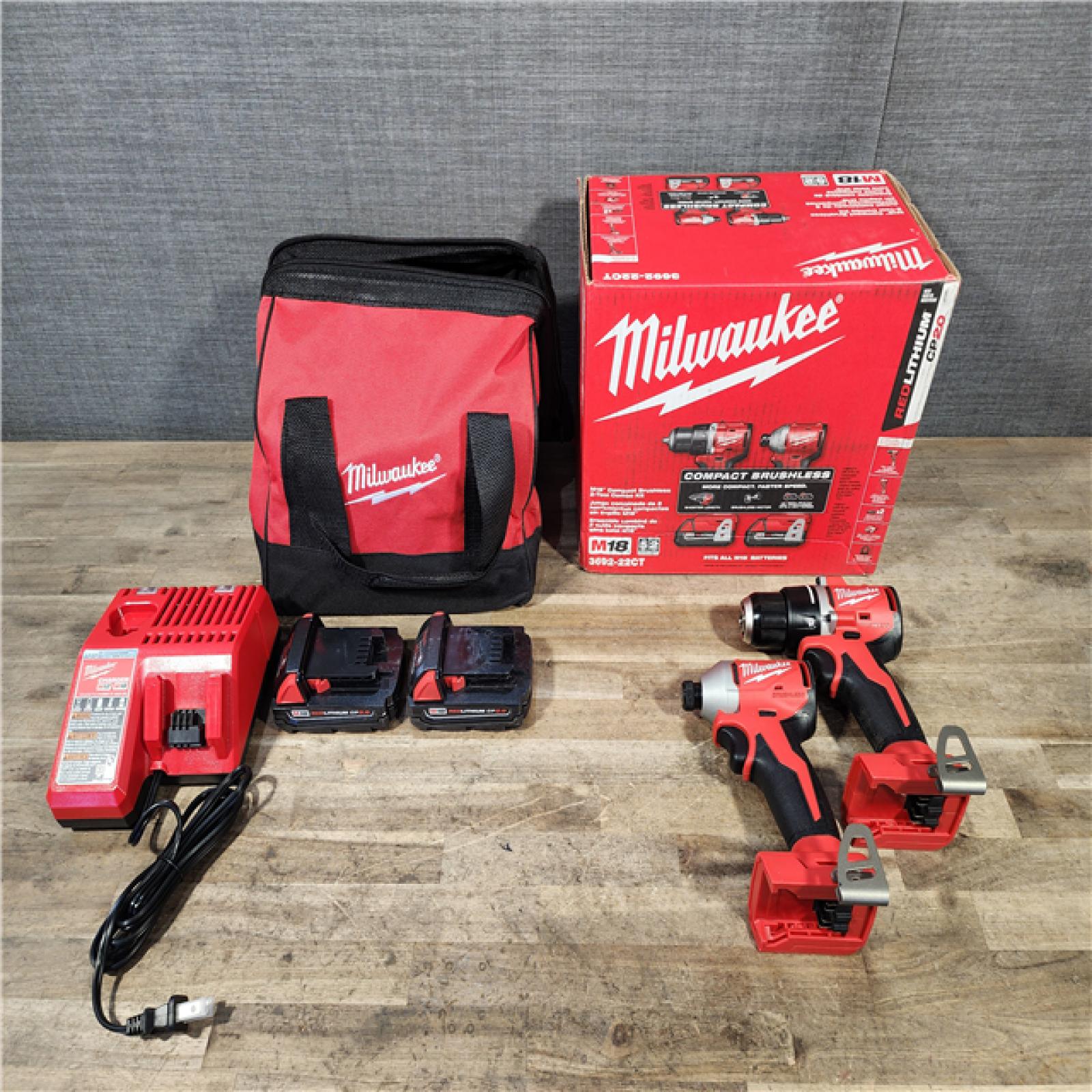 HOUSTON LOCATION - AS-IS Milwaukee M18 18V Lithium-Ion Brushless Cordless Compact Drill/Impact Combo Kit (2-Tool) W/(2) 2.0 Ah Batteries  Charger & Bag