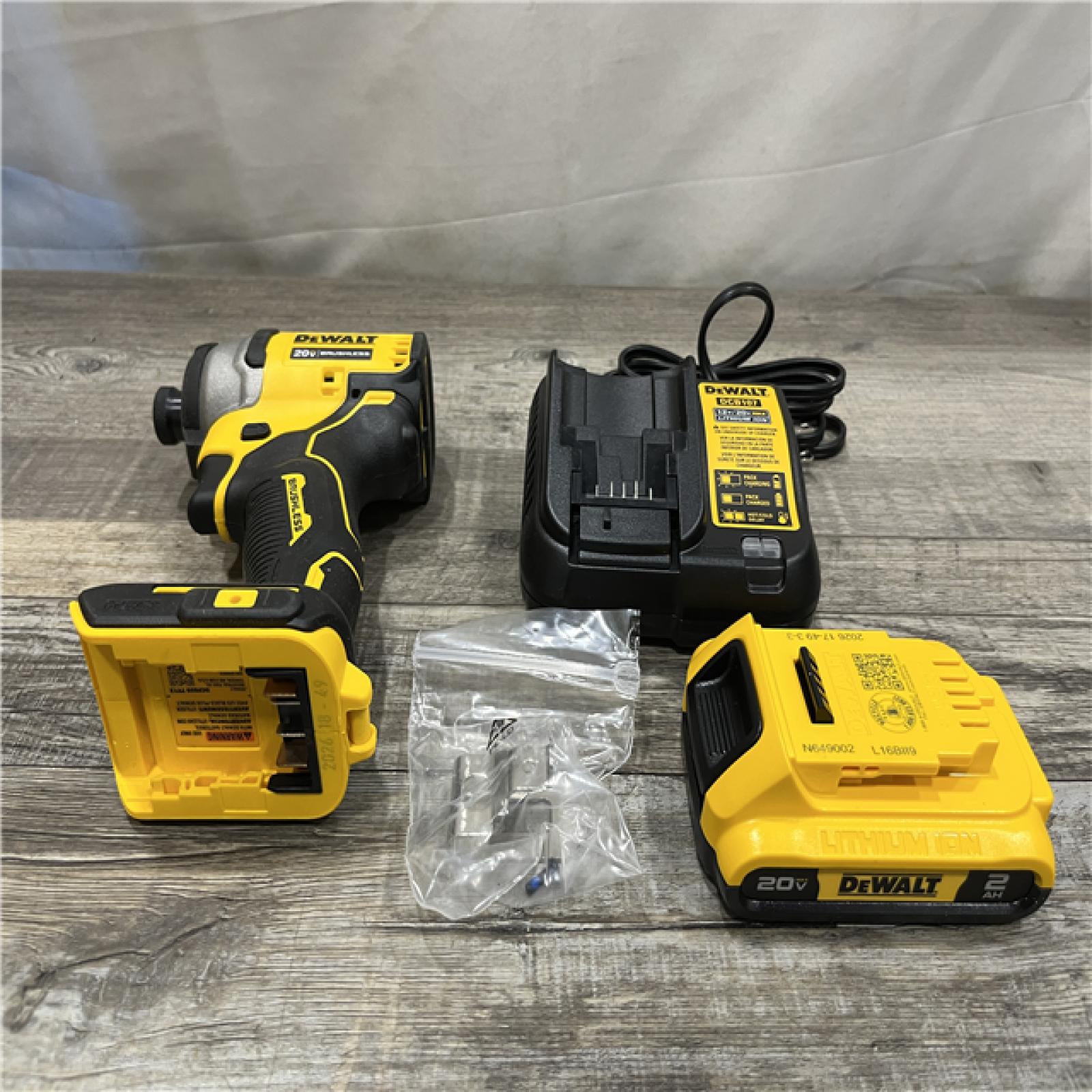 AS-IS DEWALT Atomic 20V Max Lithium-Ion Brushless Cordless Compact 1/4 in. Impact Driver Kit
