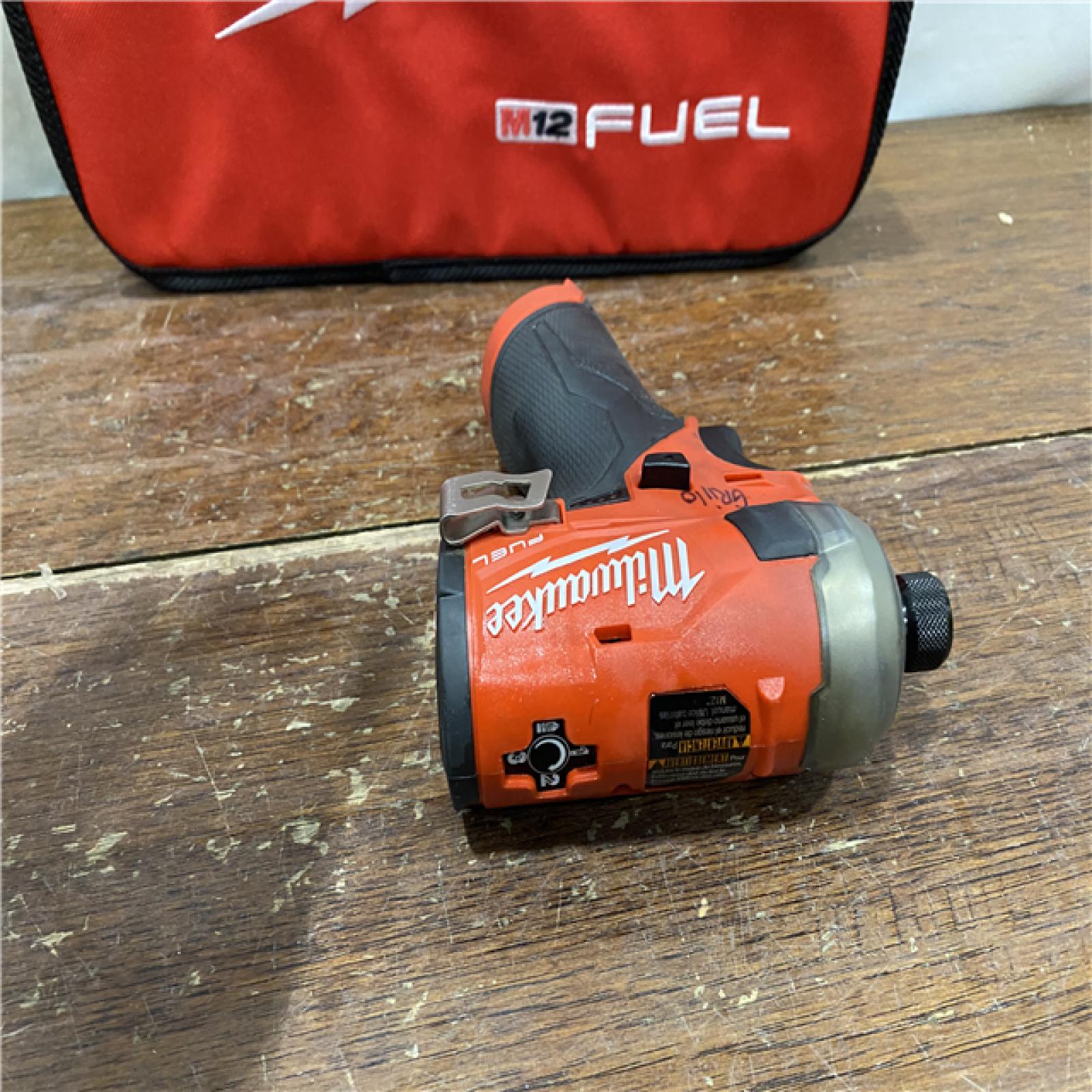 AS-IS M12 FUEL SURGE 12V Lithium-Ion Brushless Cordless 1/4 in. Hex Impact Driver Compact Kit W/Two 2.0Ah Batteries, Bag