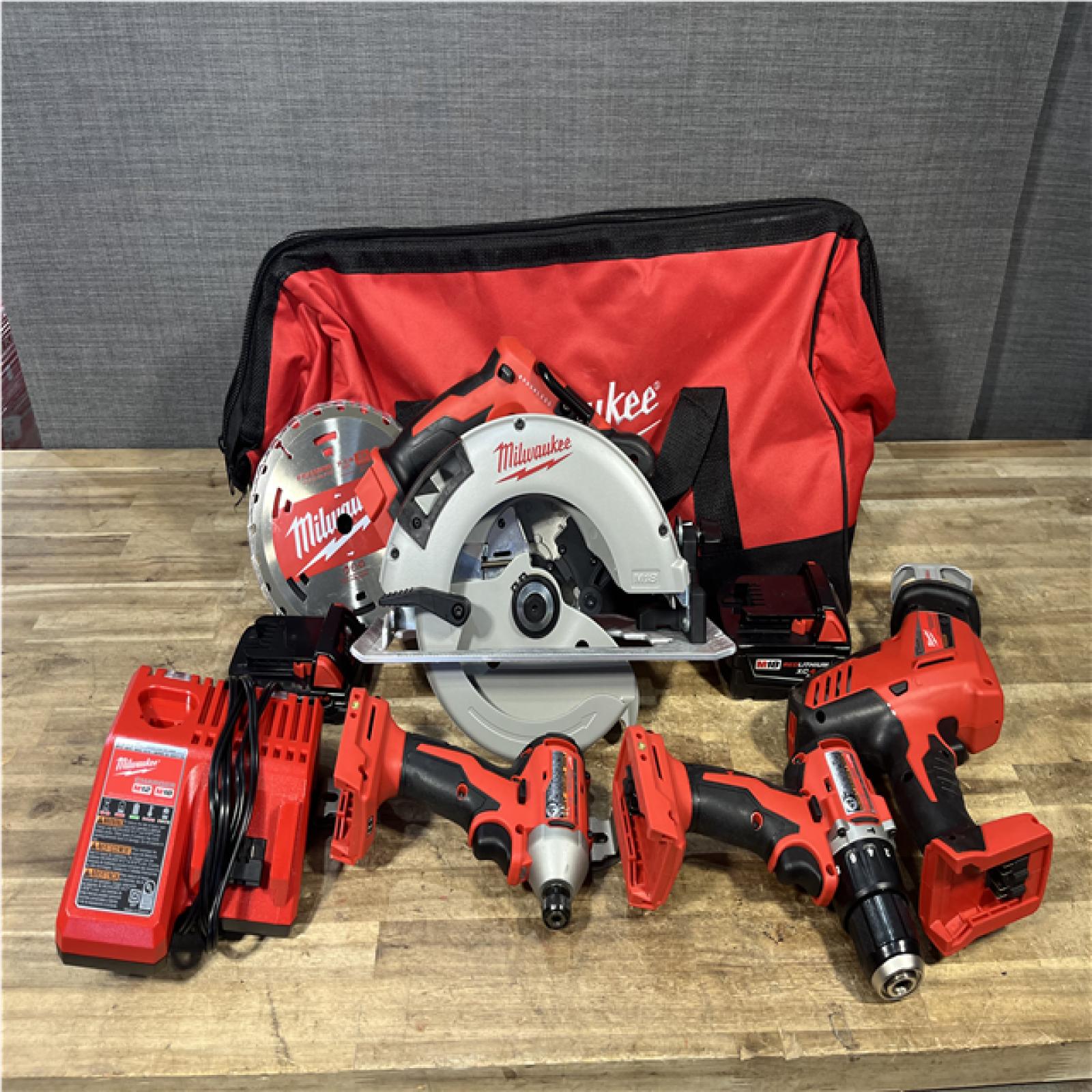 Houston Location AS-IS Milwaukee Hammer Drill Driver and Impact Driver Hackzall and Circular Saw and Batteries QTY/2 with Charger