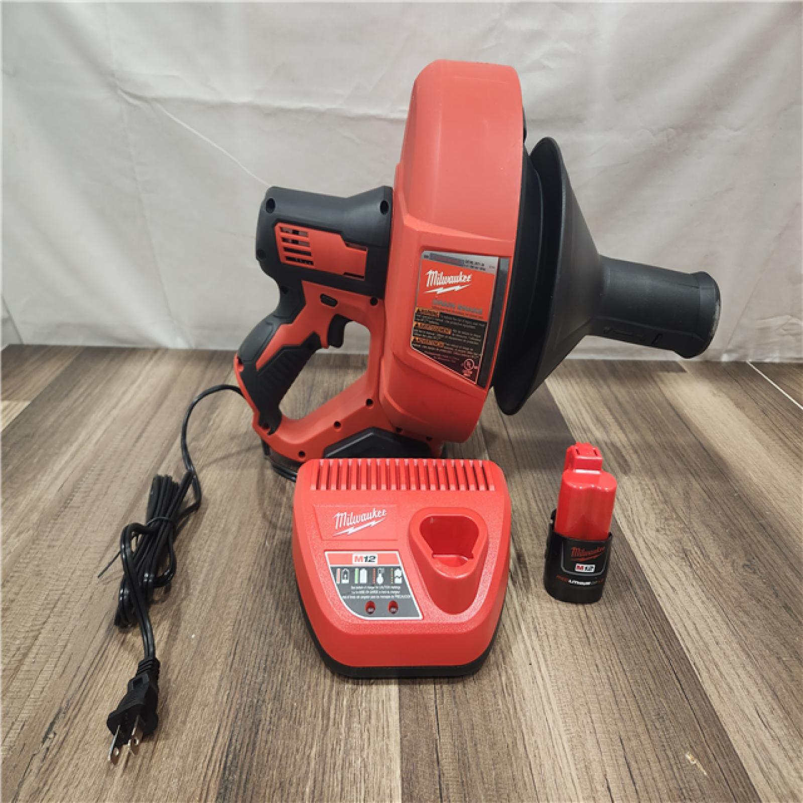 AS-IS- M12 12-V Lithium-Ion Cordless Drain Snake Auger W/ (1) 1.5Ah Battery  5/16 in. X 25 Ft. Cable  Charger  & 5 Gal. Bucket