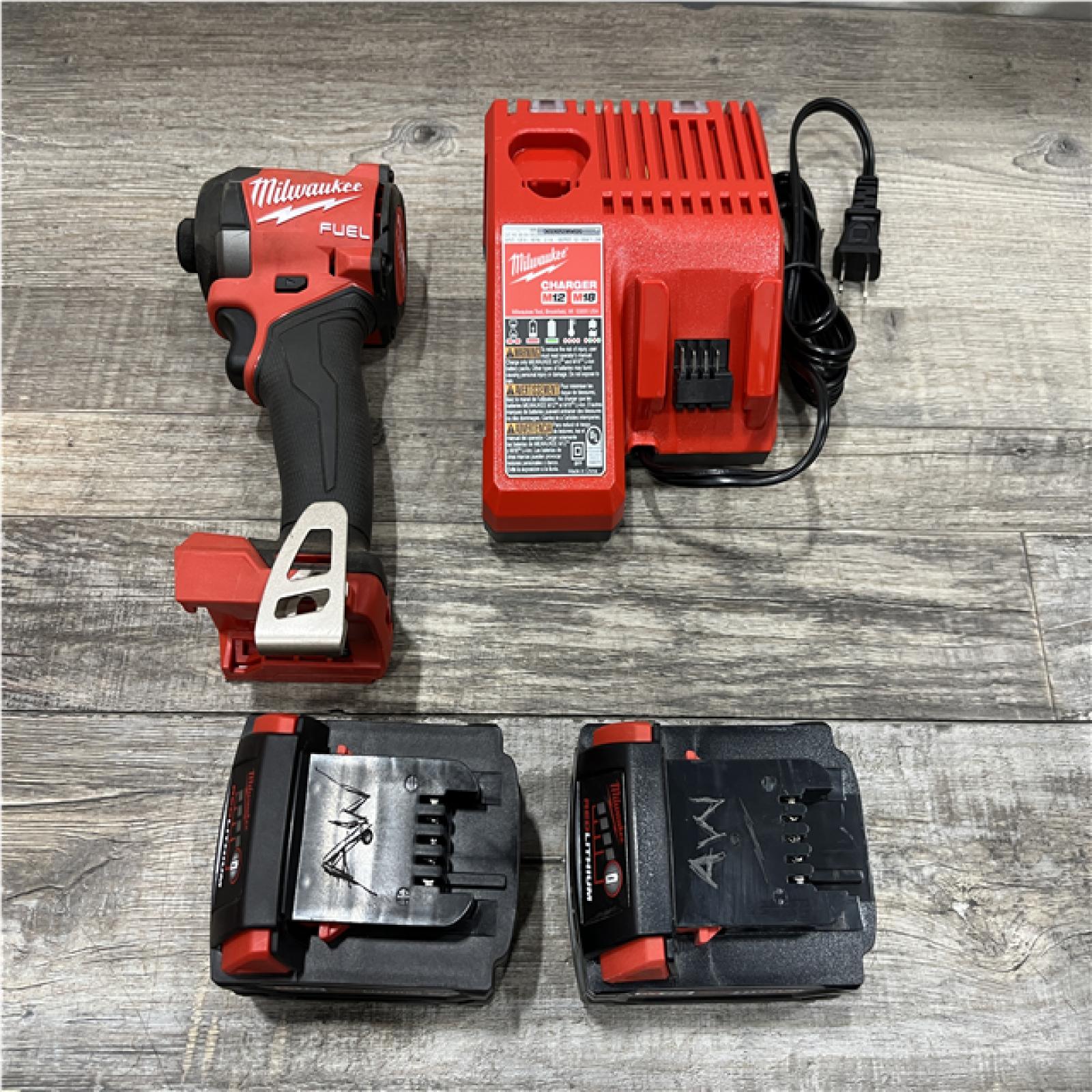 AS-IS Milwaukee FUEL 18V Lithium-Ion Brushless Cordless 1/4 in. Hex Impact Driver Kit