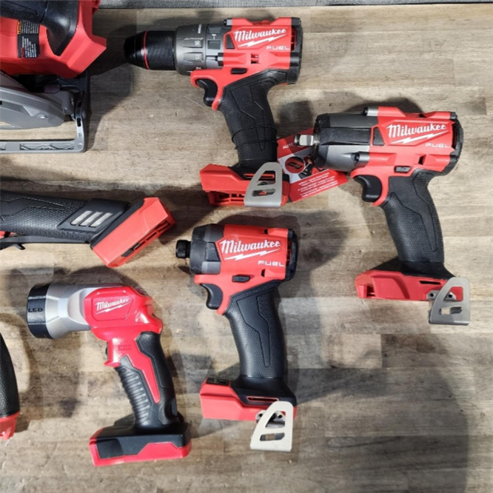 HOUSTON LOCATION - AS-IS Milwaukee M18 FUEL 18V Lithium-Ion Brushless Cordless Combo Kit with Two 5.0 Ah Batteries  1 Charger  2 Tool Bags (7-Tool)