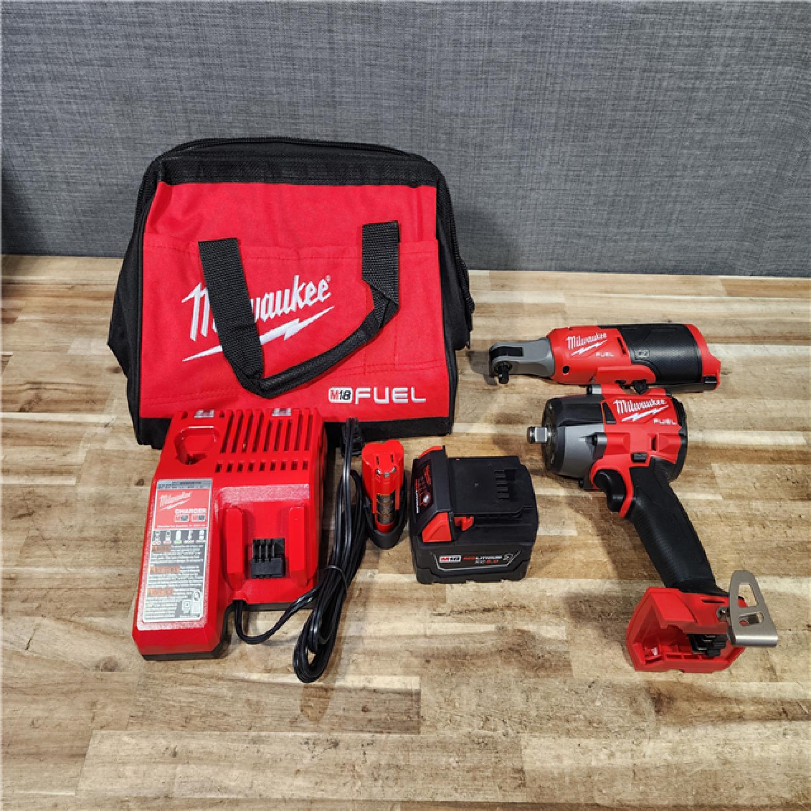HOUSTON LOCATION - AS - IS Milwaukee FUEL 18V Cordless Mid Torque 1/2 in. Impact Wrench w/ M12 FUEL 3/8 in. Ratchet & Battery/Charger Combo Kit