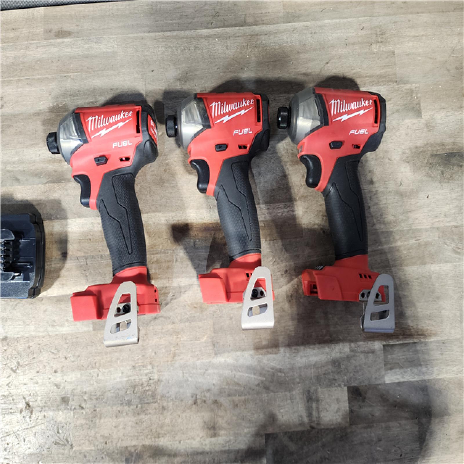 HOUSTON LOCATION - AS-IS MILWAUKEE 3 TOOL COMBO KIT W/ (2) BATTERY & CHARGER